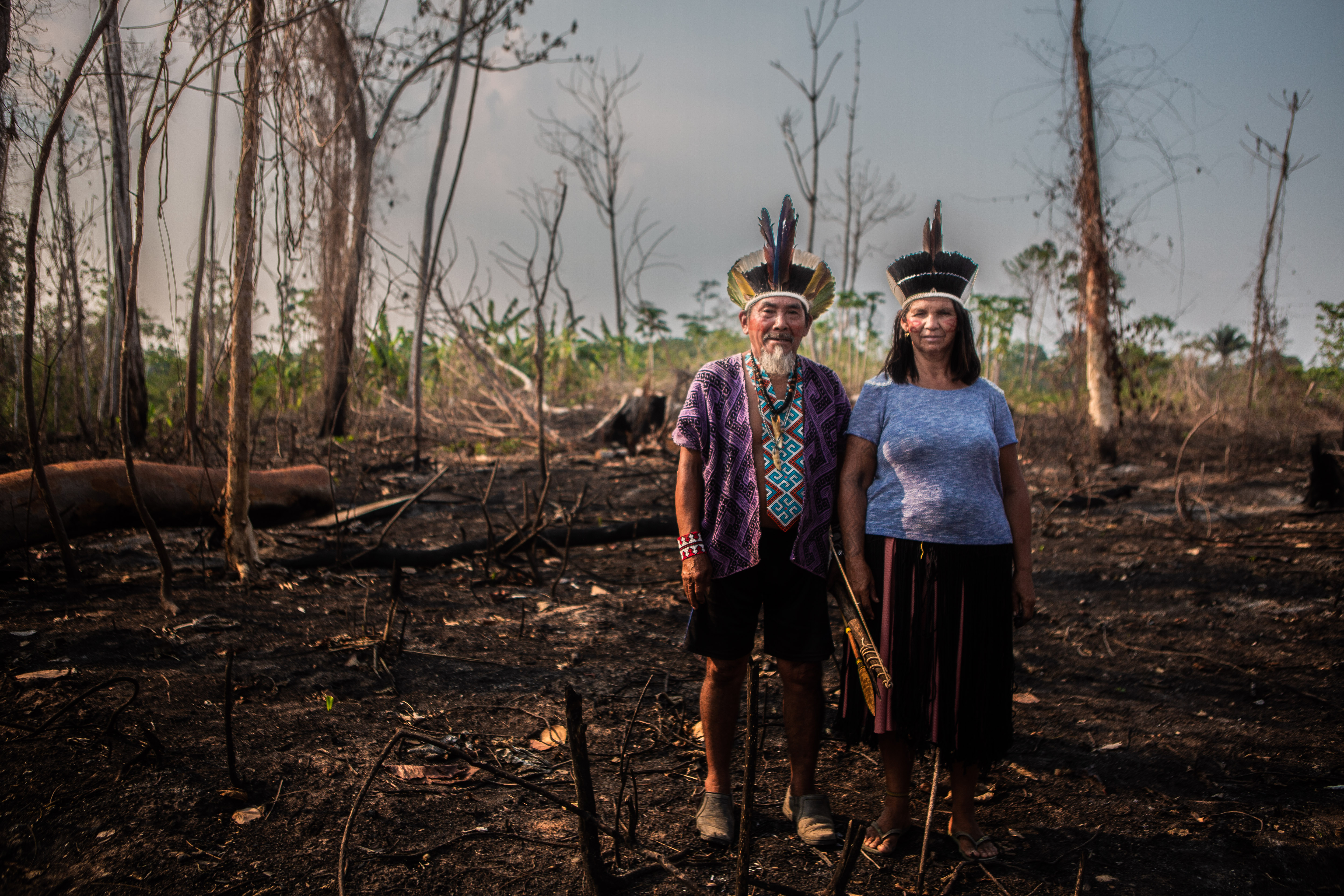 Indigenous couple on their burnt land