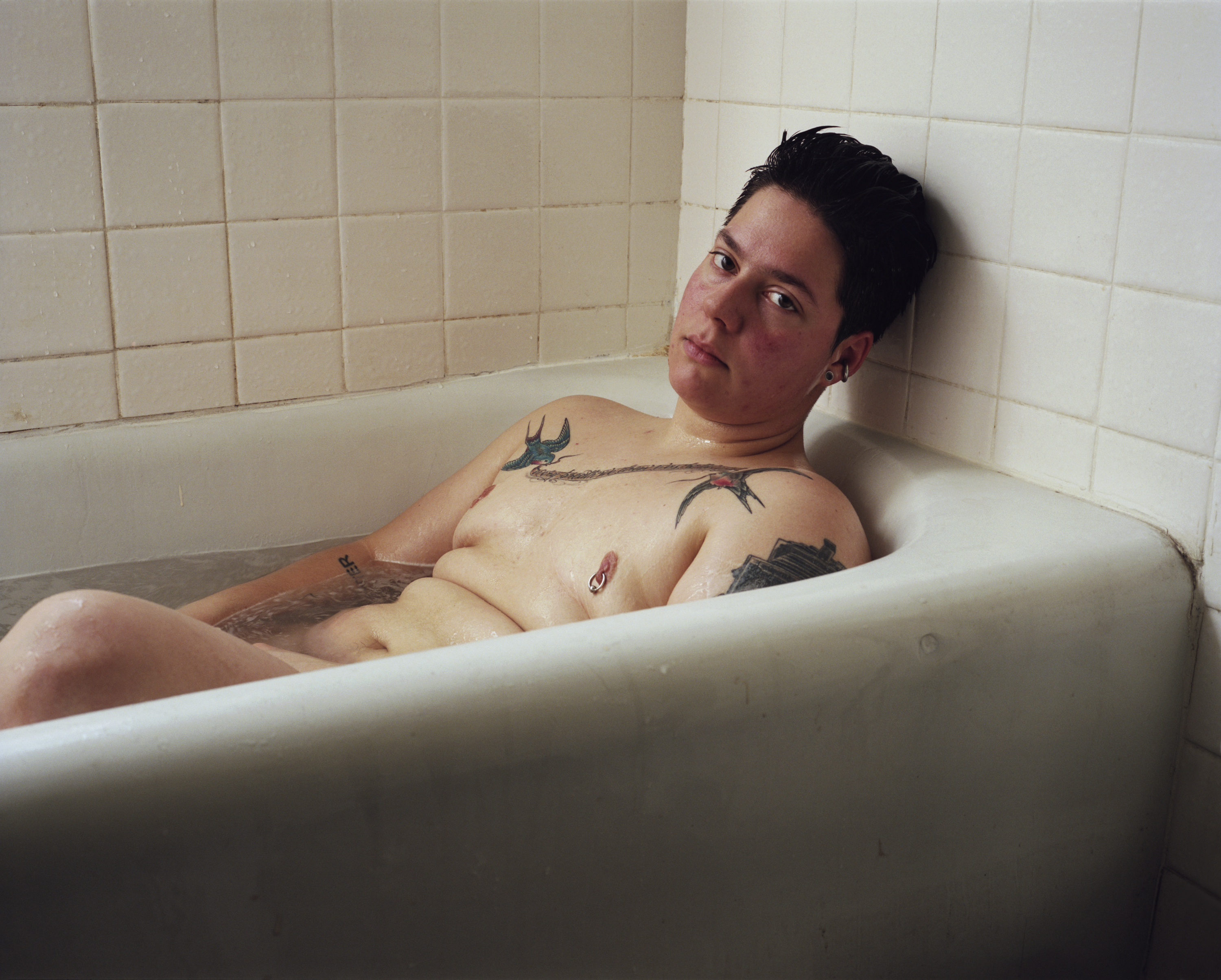1572239415087-Jess-Dugan-Self-portrait-bath_2012