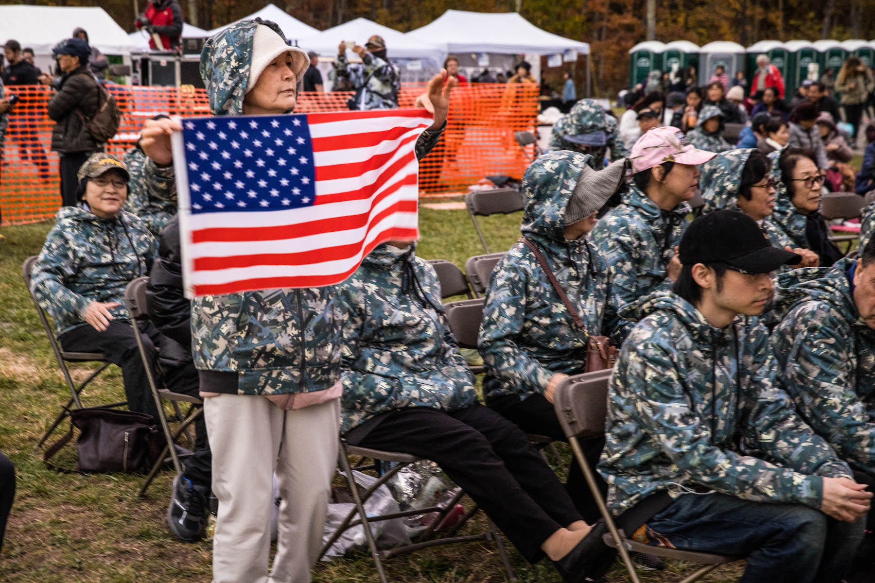 Pastor Moon's supporters from Japan and Korea soaked up the MAGA-friendly atmosphere. Many wore camo hoodies sold through the church.