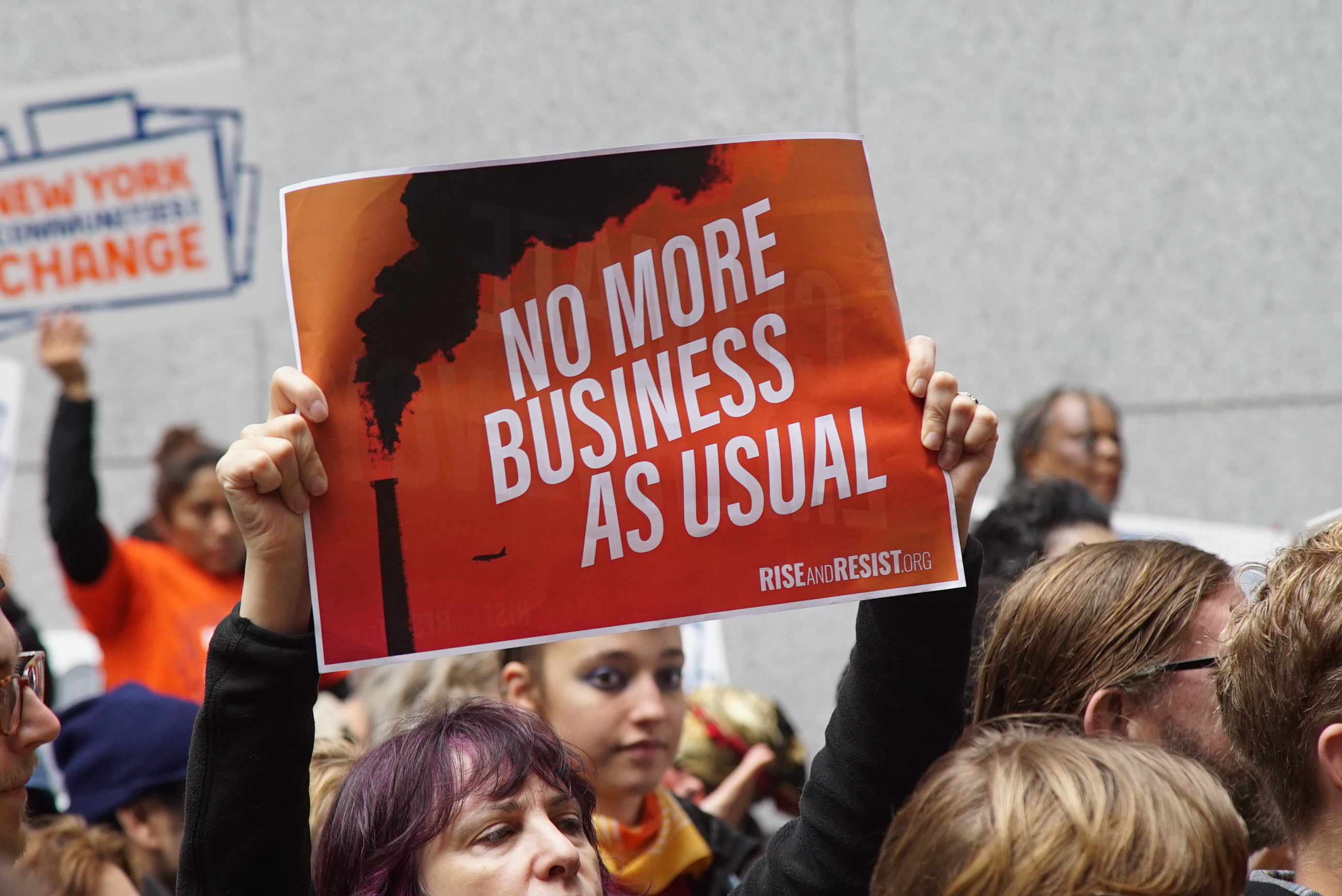 1572620923104-NYC-Oct-29-No-More-Business-As-Usual-sign
