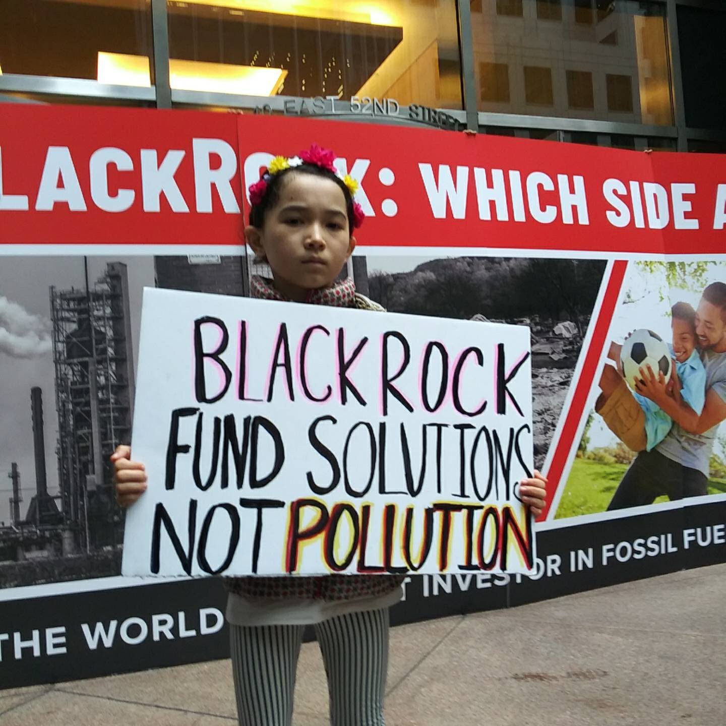 1572620946945-NYC-Oct-29-kid-in-front-of-banner