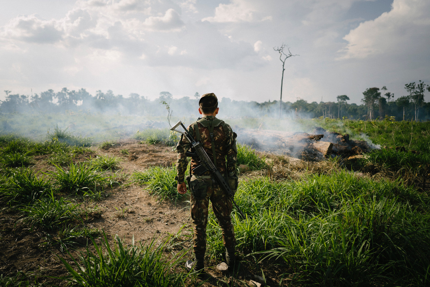 A soldier checks a fire spot in Novo Progresso, a two-hour drive into the jungle.