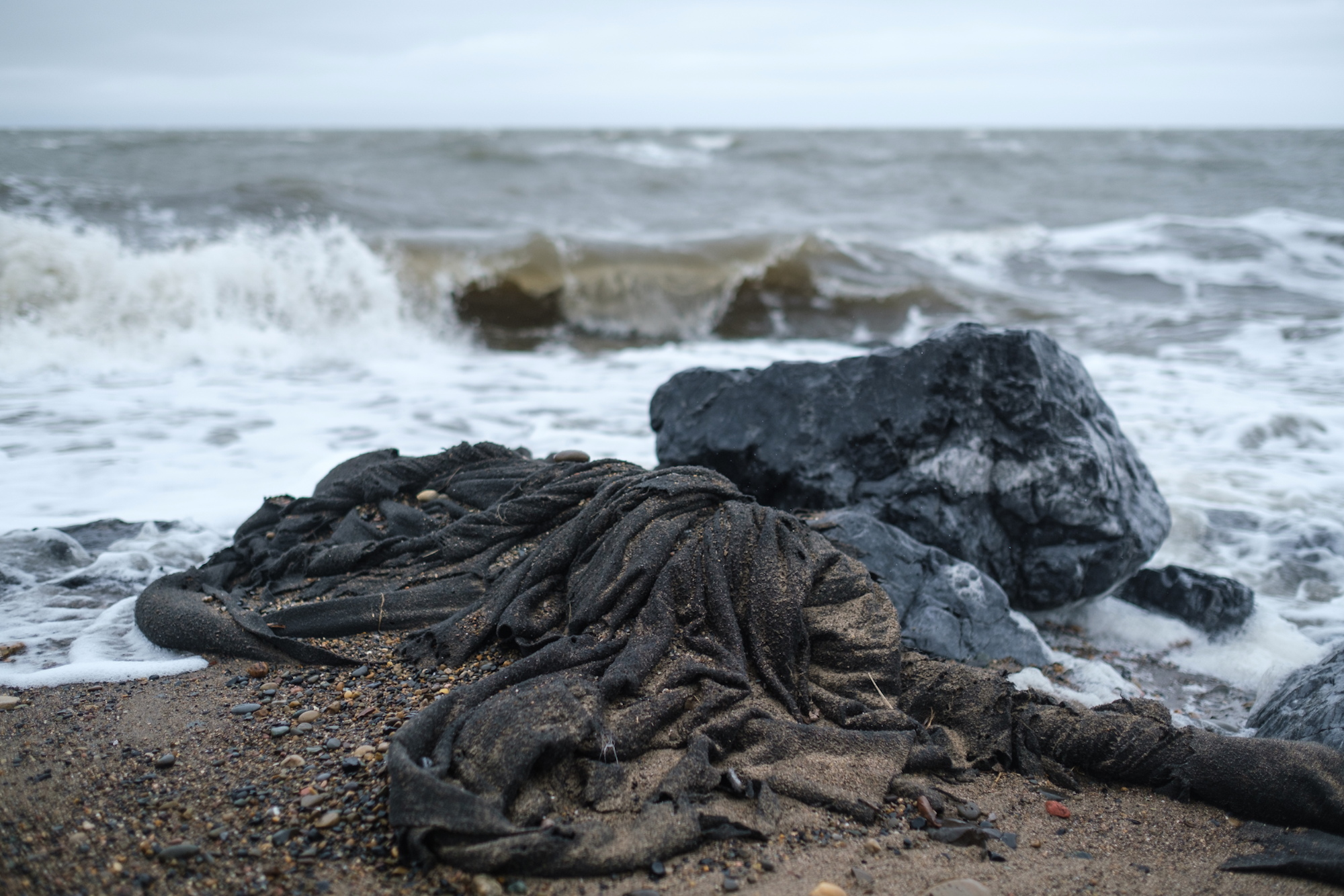 Geotextile meant to reinforce Tuktoyaktuk Beach, tattered by the waves.