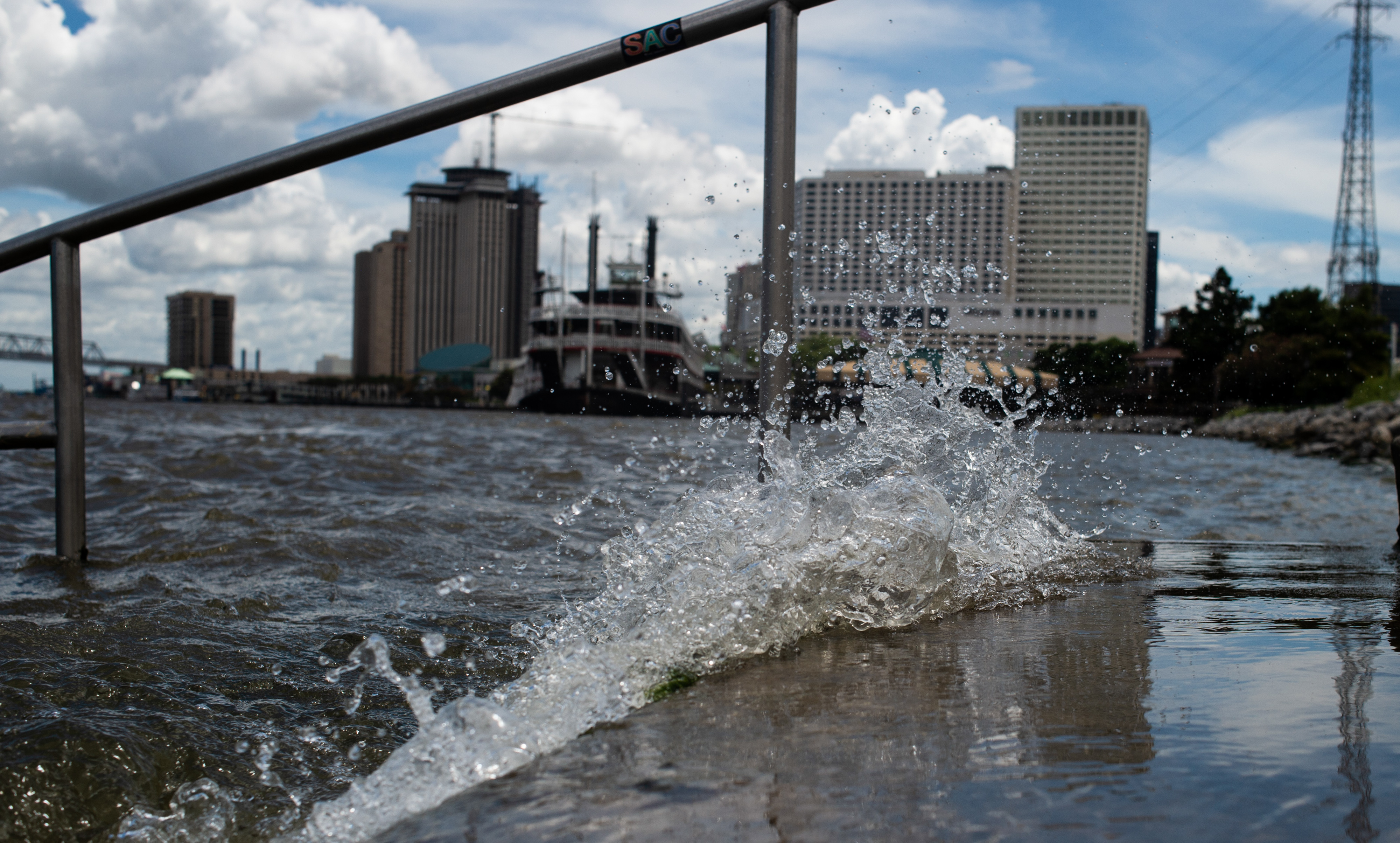 Water splashing against a levee in New Orleans