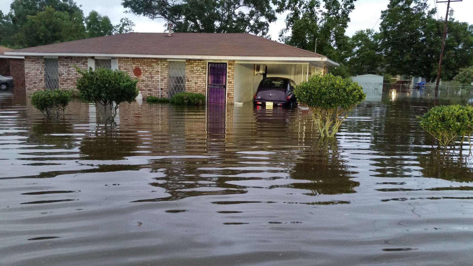 A home in Pecan Acres during the flood of August 2016. Photo courtesy of Edward Bazile