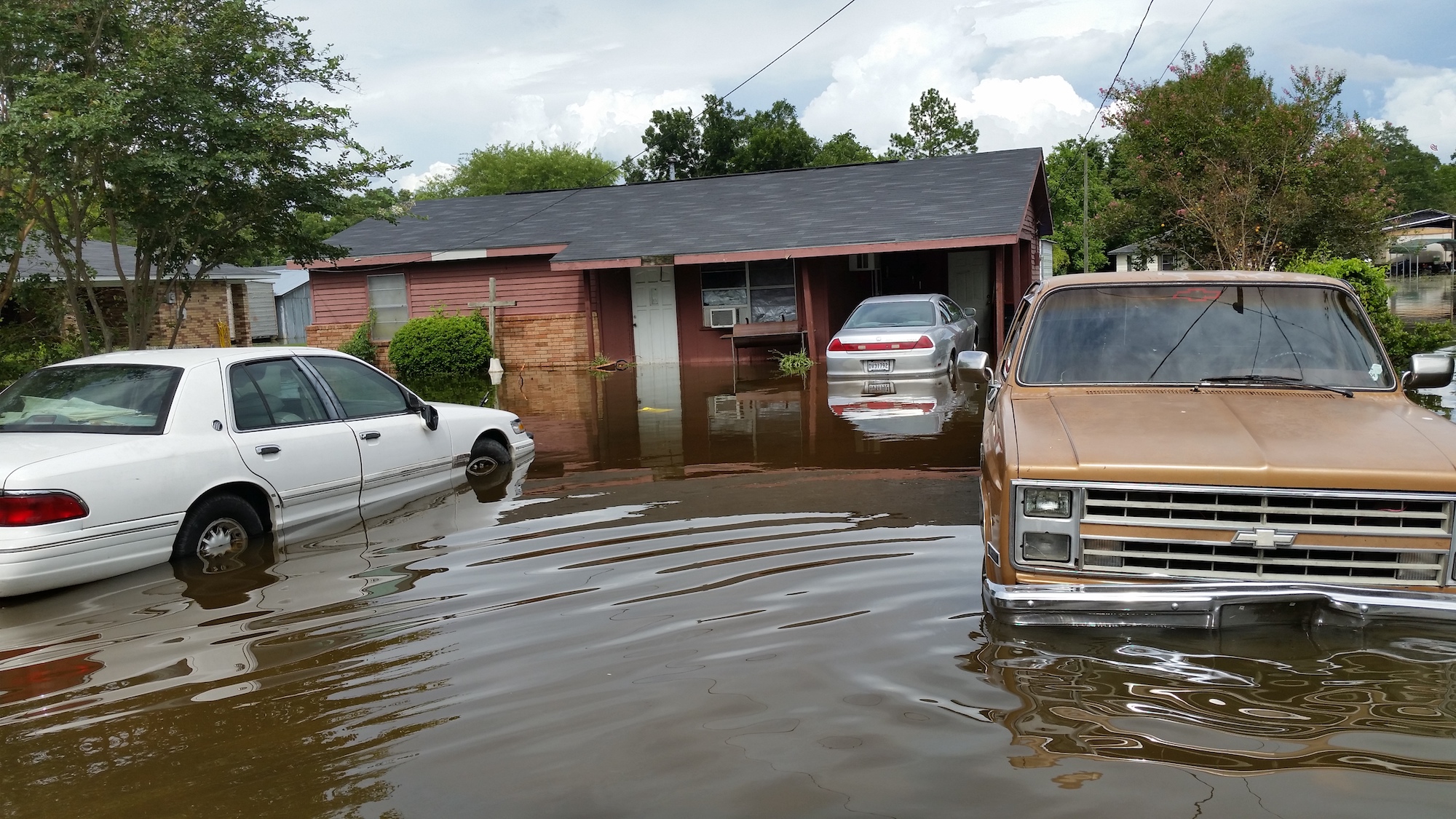 Flood waters touching the undercarriage of vehicles in August 2016.