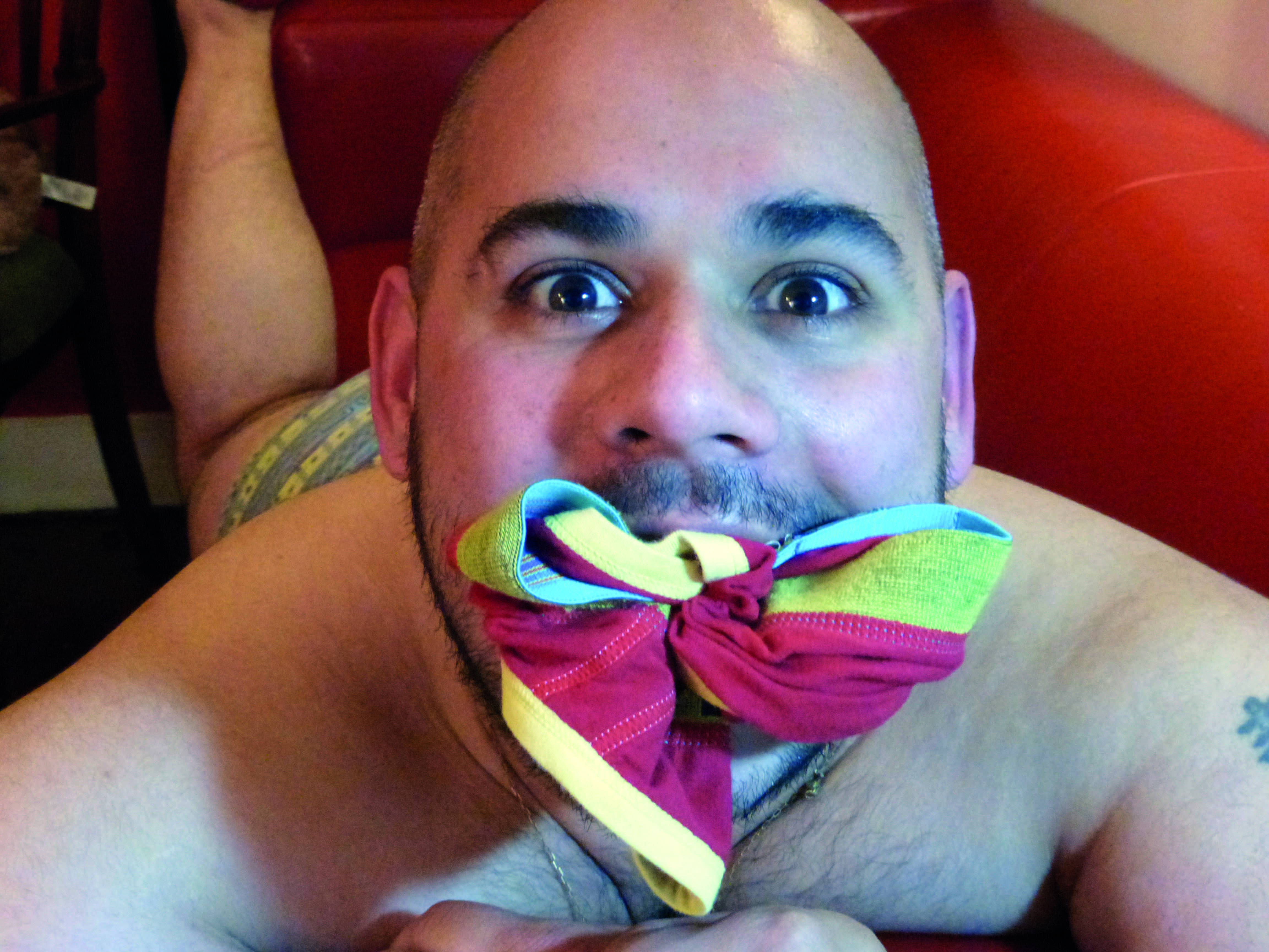 A man with pants in his mouth in Through Positive Eyes