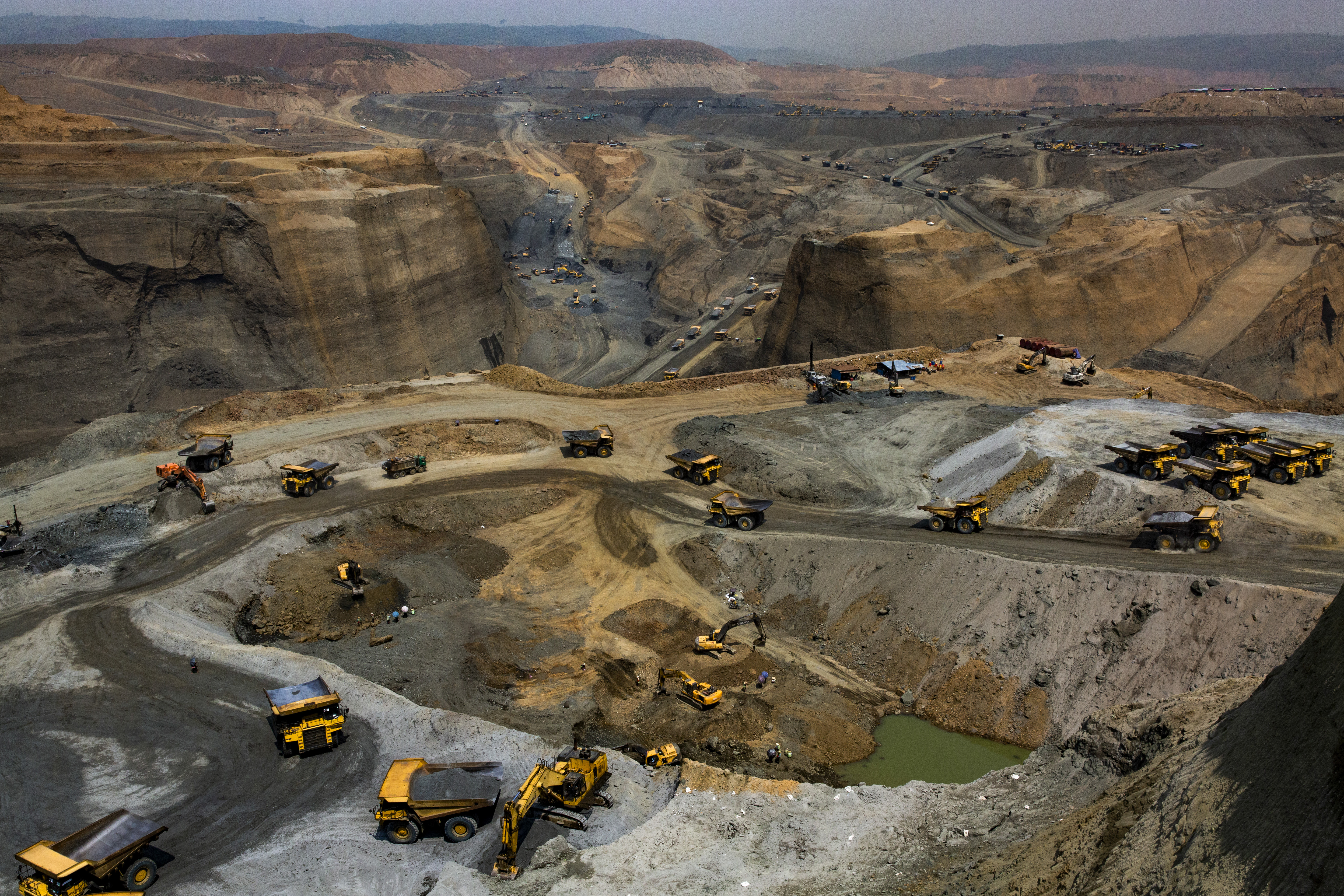 Company trucks operating at a government-licensed jade mining site in Hpakant, Kachin State, Myanmar on May 17, 2019