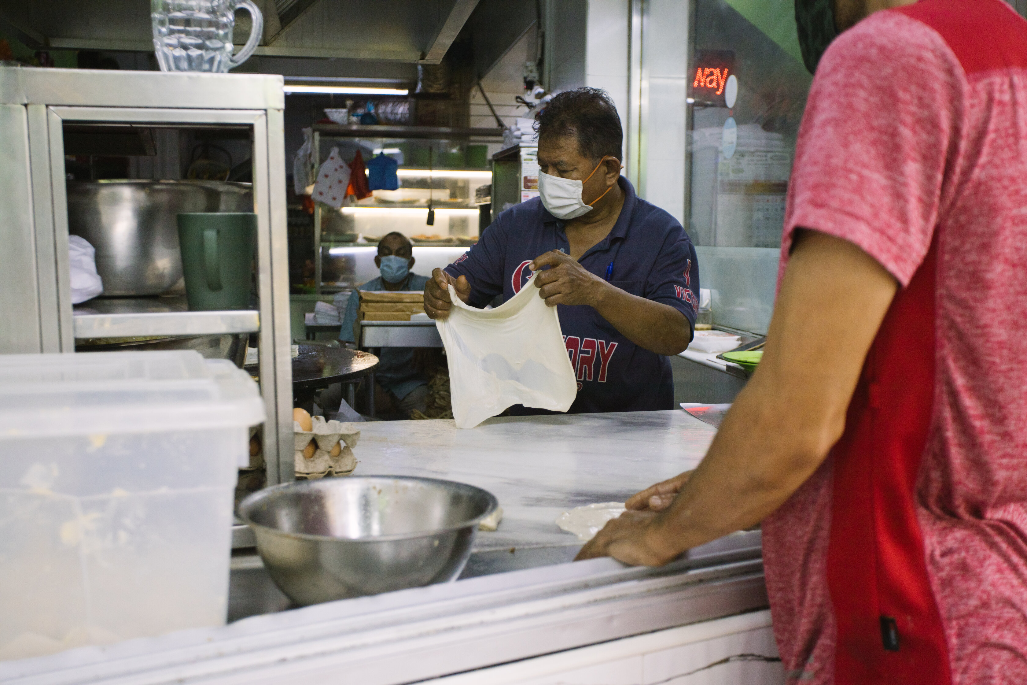 A worker at Victory restaurant prepares dough. PHOTO: YUSUF ABDOL HAMID​