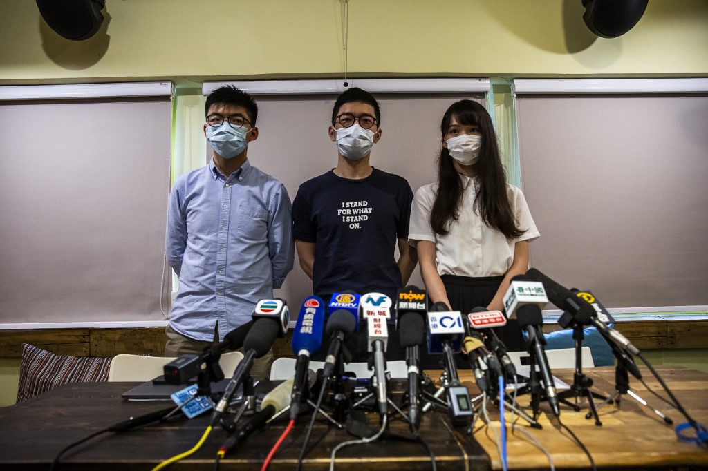 Joshua Wong, Nathan Law and Agnes Chow hold a press conference in Hong Kong on May 30, 2020. 