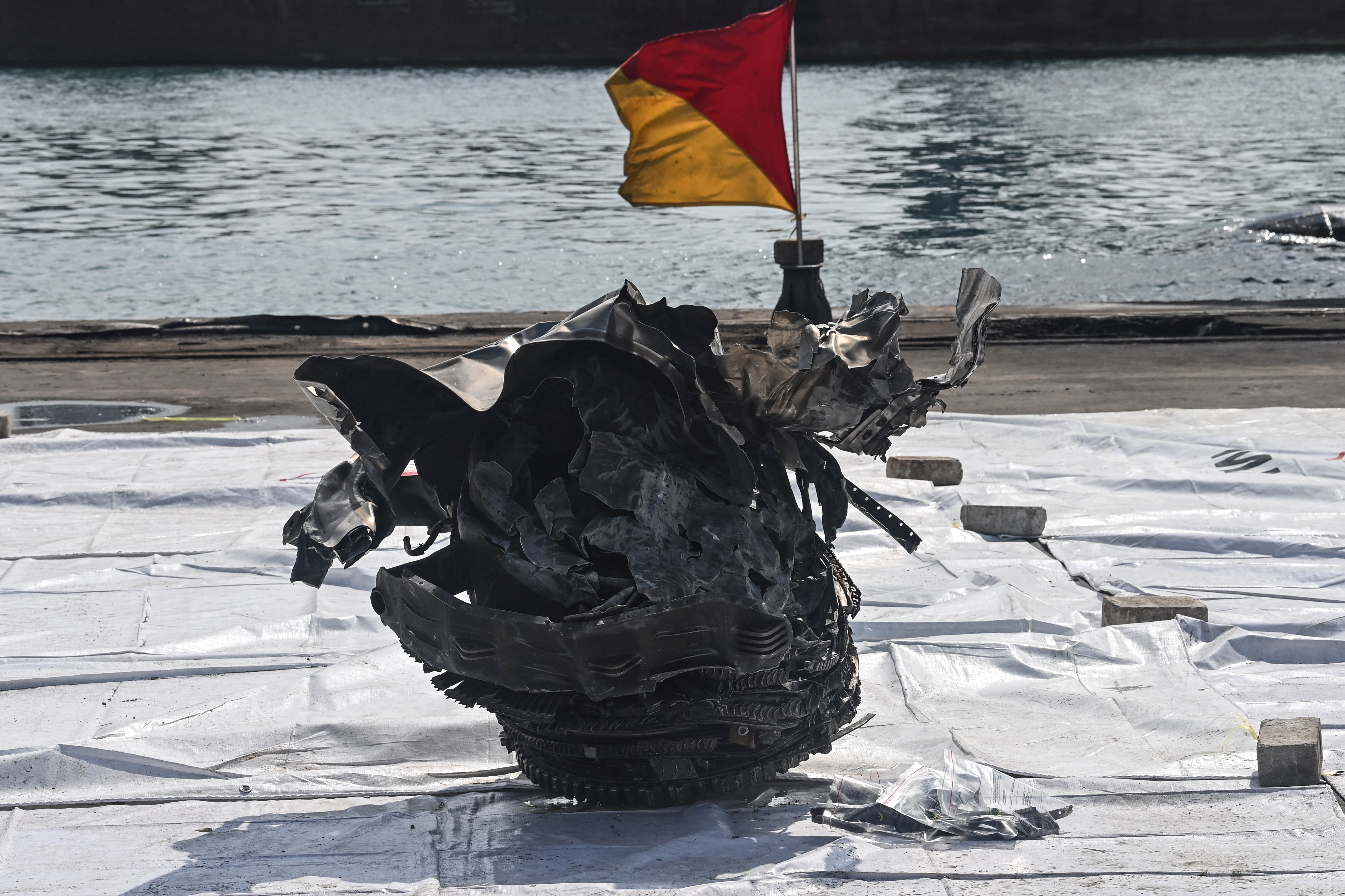 A piece of wreckage recovered at sea. (AFP PHOTO BY ADEK BERRY)