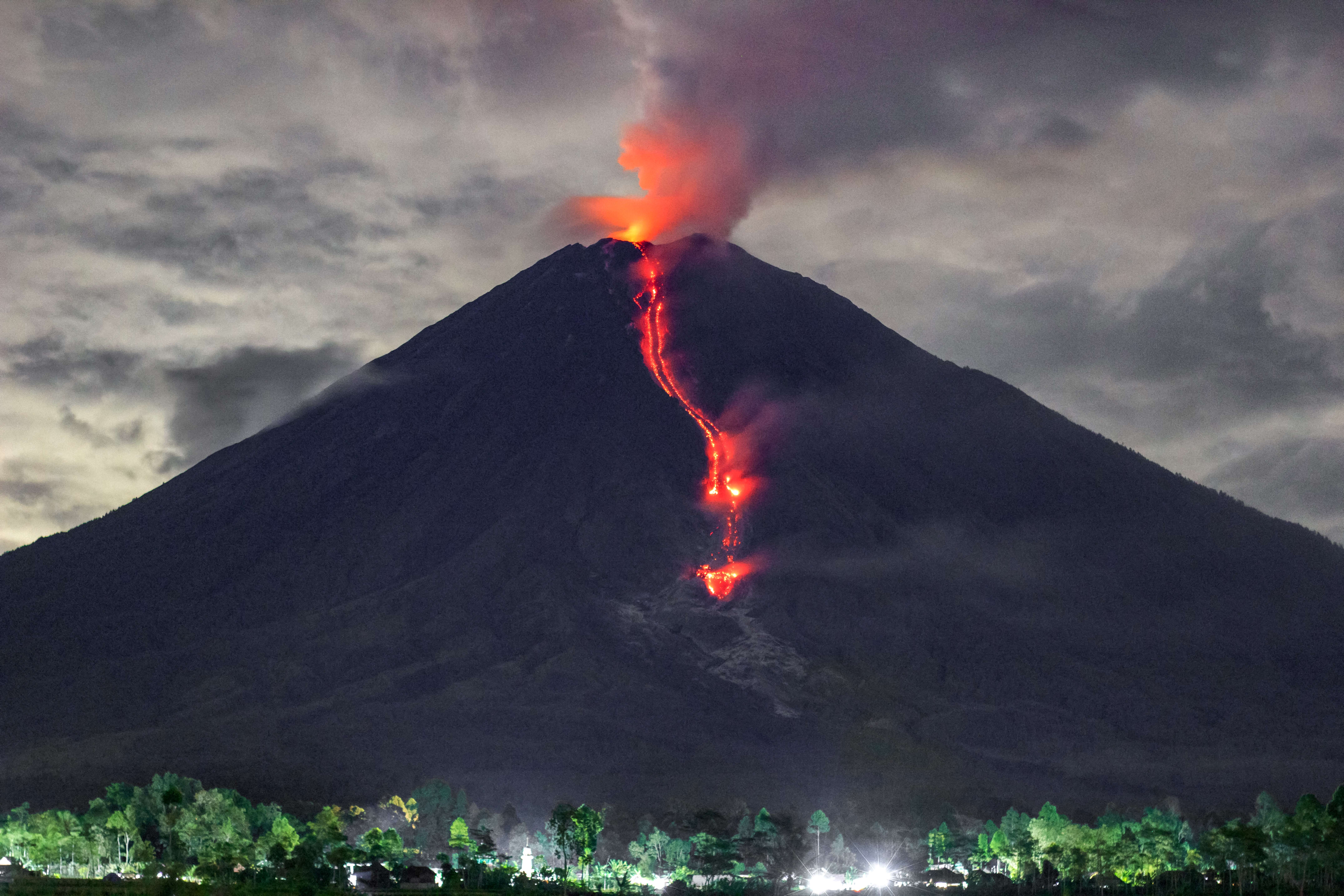 Lava is seen during an eruption of Mount Semeru. (PHOTO: AFP / Agus Harianto)