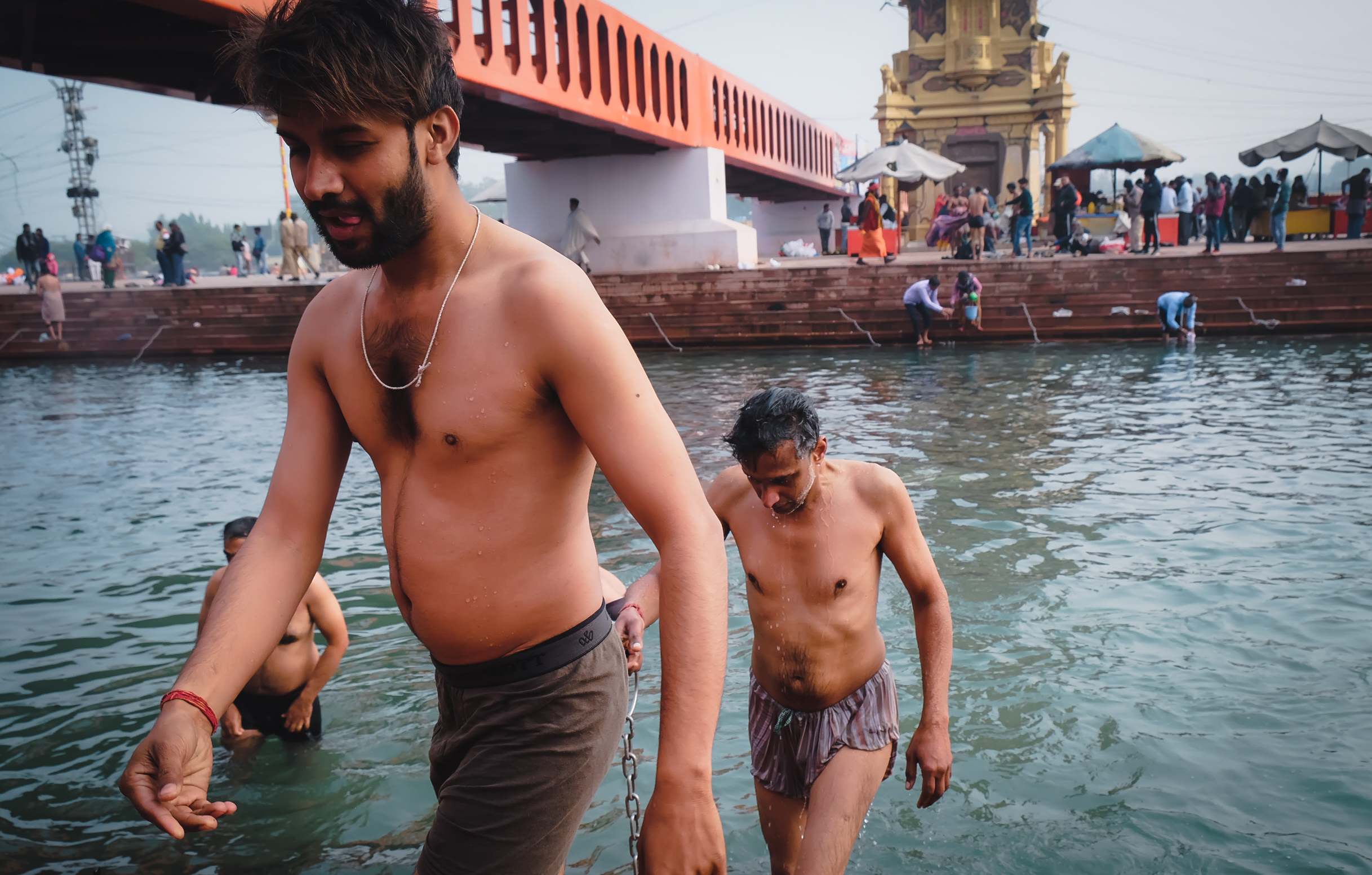 devotees take holy dip in the ganga river during kumbh mela