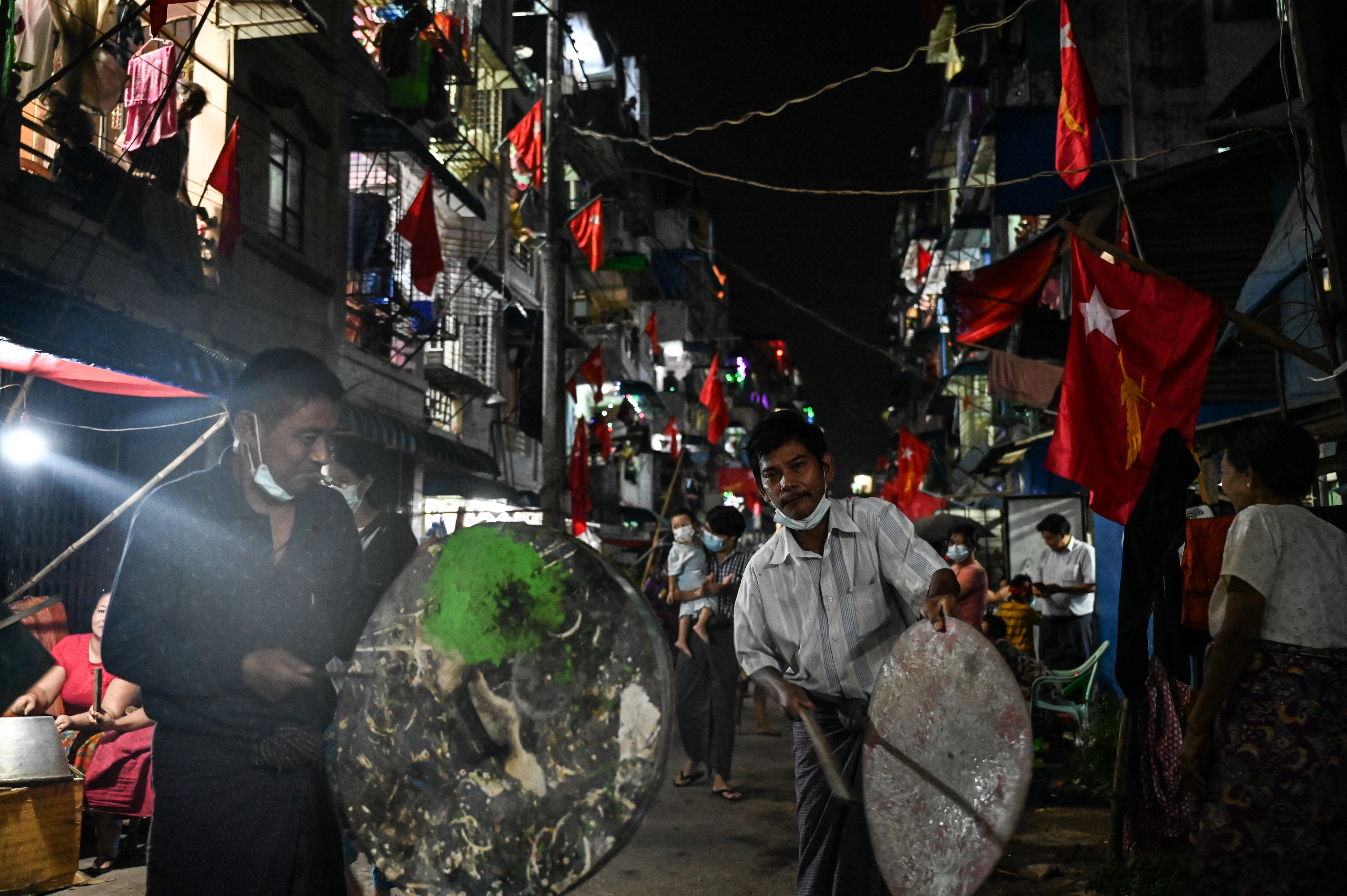 Residents take part in a noise campaign on a street in Yangon. PHOTO: AFP