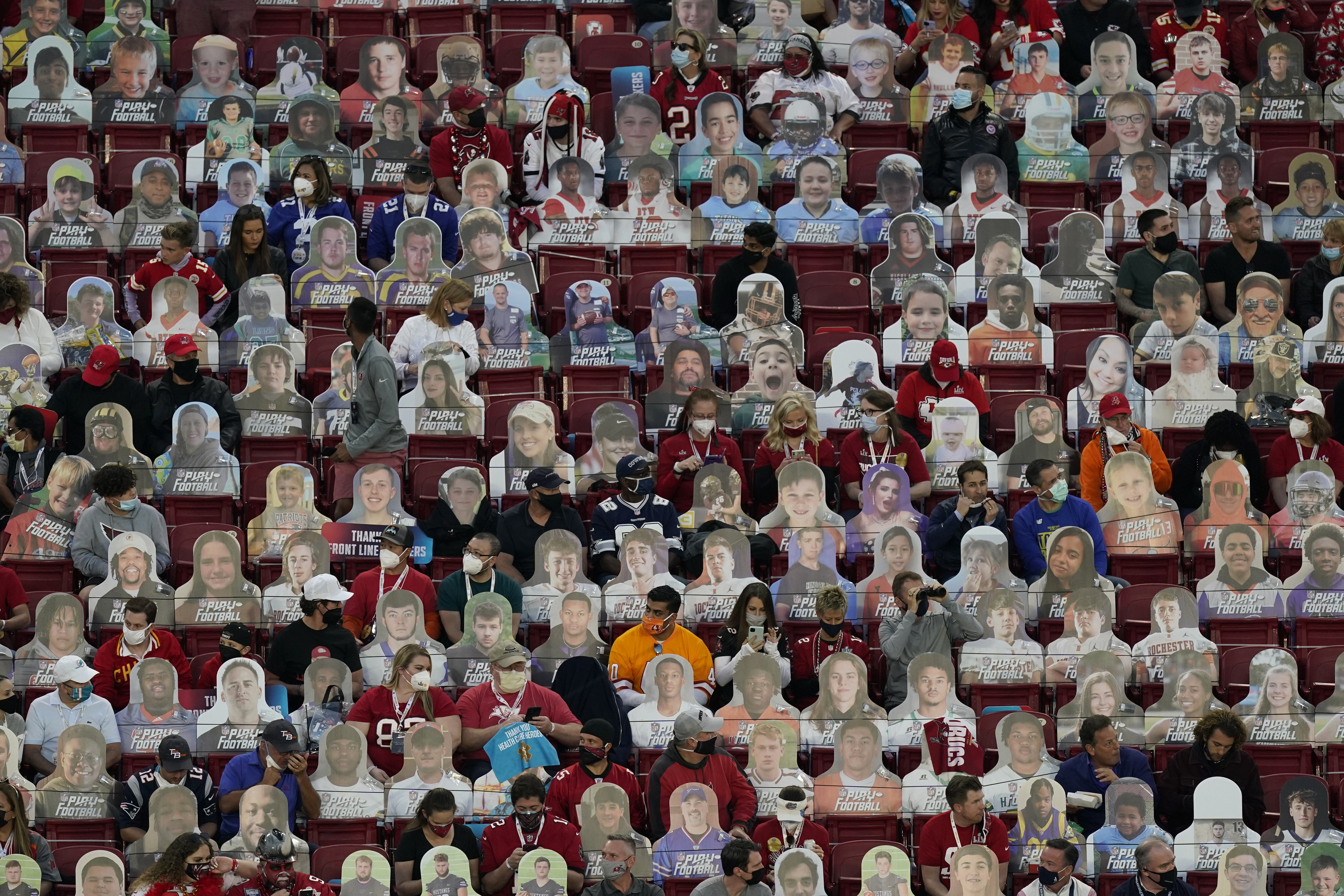 Fans sit among cardboard cutouts before the NFL Super Bowl 55 football game between the Kansas City Chiefs and Tampa Bay Buccaneers, Sunday, Feb. 7, 2021, in Tampa, Fla.