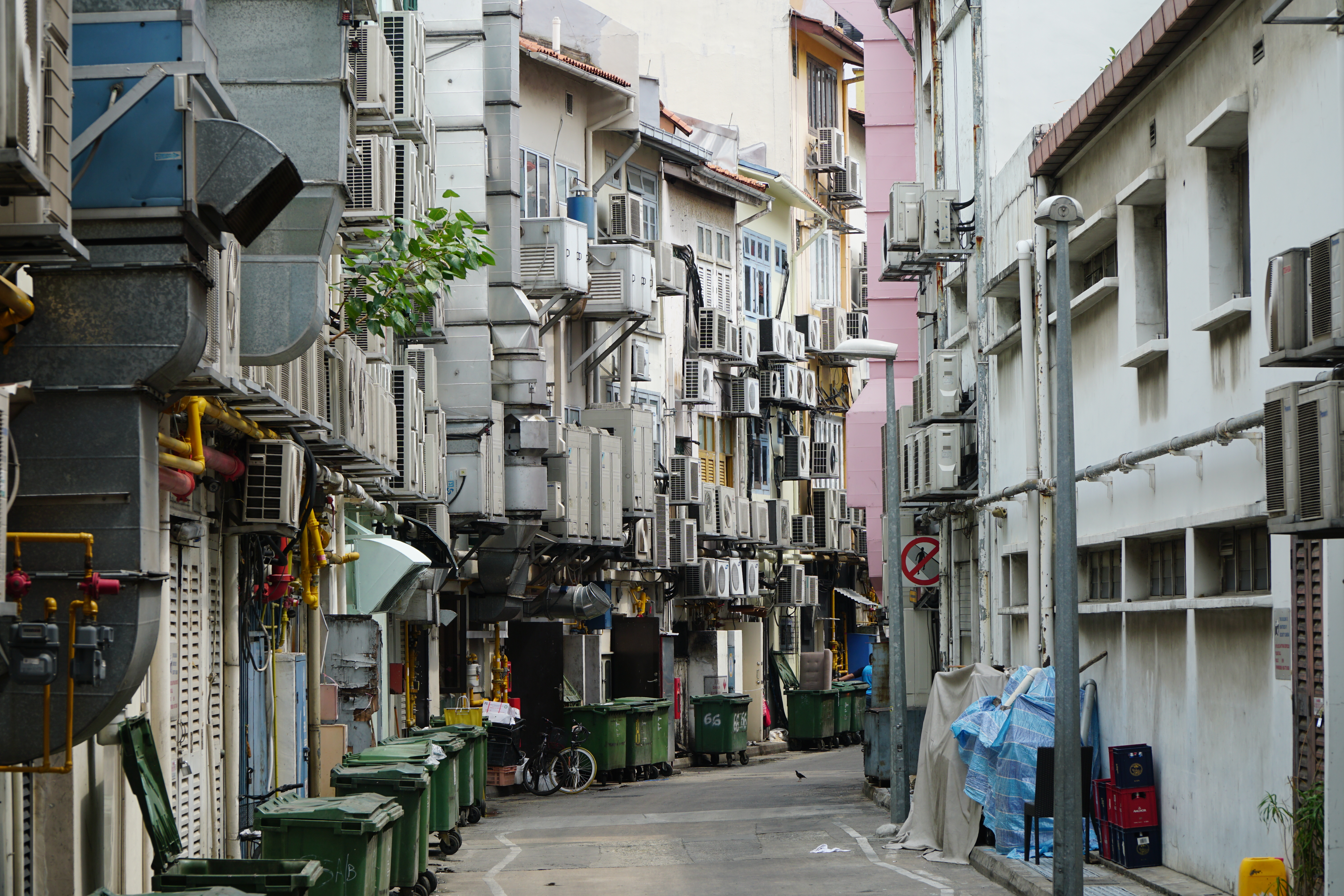 Air conditioning units at a back alley in Singapore. See the problem? (CREDIT: Taro Hama / GETTY CREATIVES)