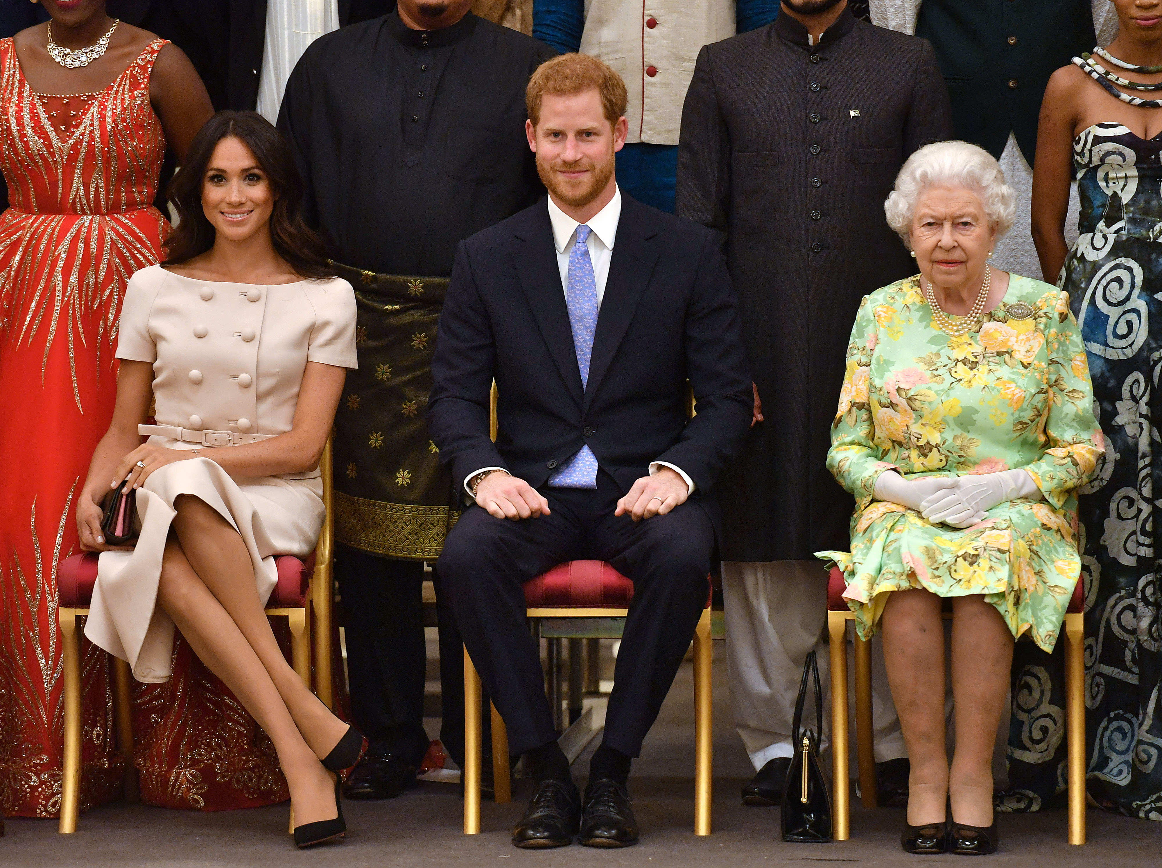Meghan, Harry and the Queen at Buckingham Palace in London. (PHOTO: AFP / John Stillwell)