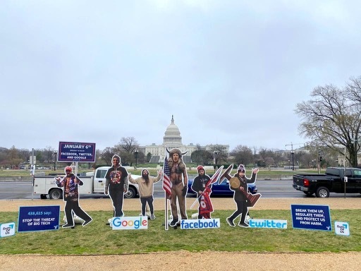 The cardboard cutout of Zuckerberg dressed as the QAnon Shaman in front of the Capitol. (Sum of Us)