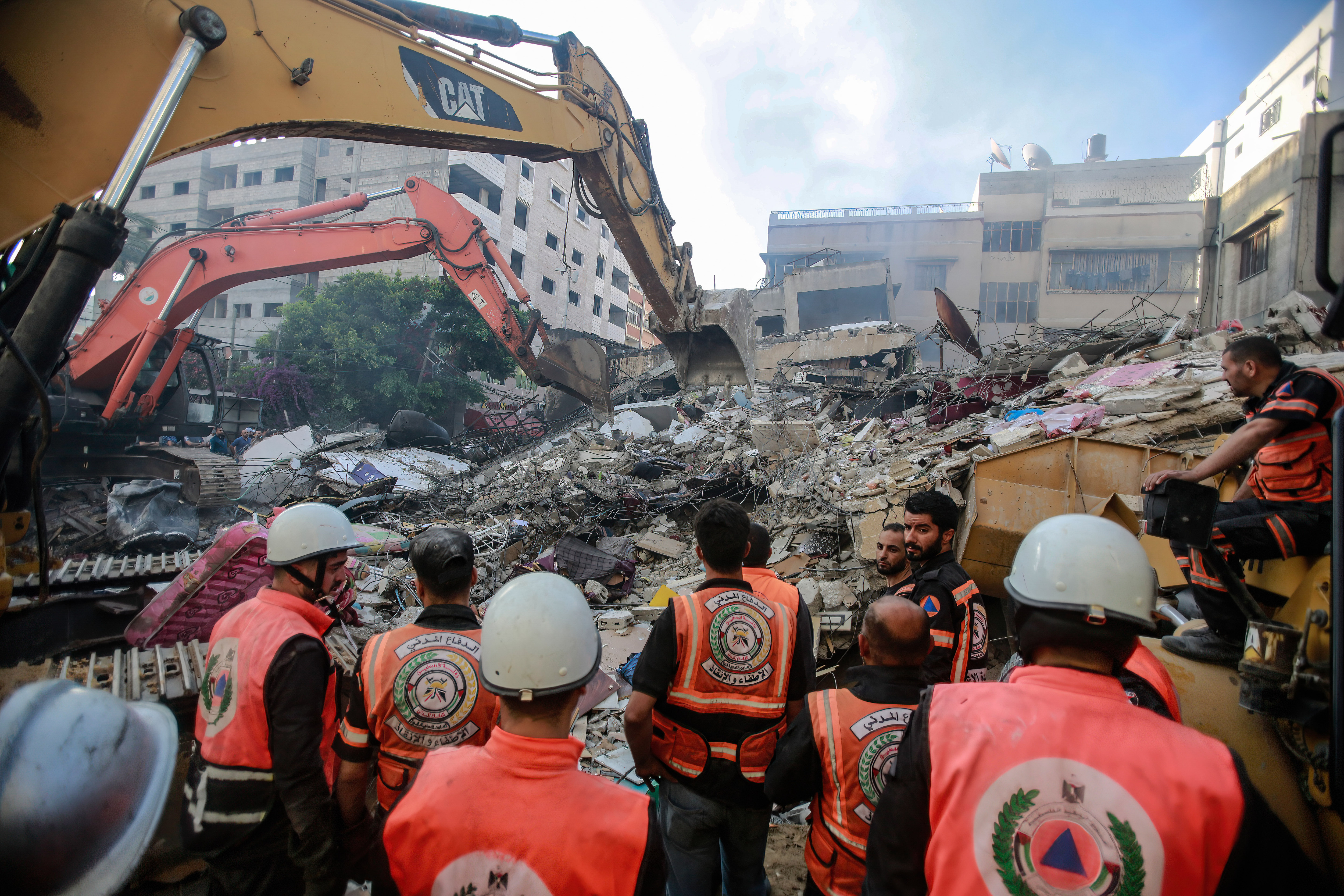 Civil defence workers search for survivors in the rubble of a destroyed house after an Israeli airstrike in Gaza City. Photo: Ahmed Zakot/SOPA Images/LightRocket via Getty Images