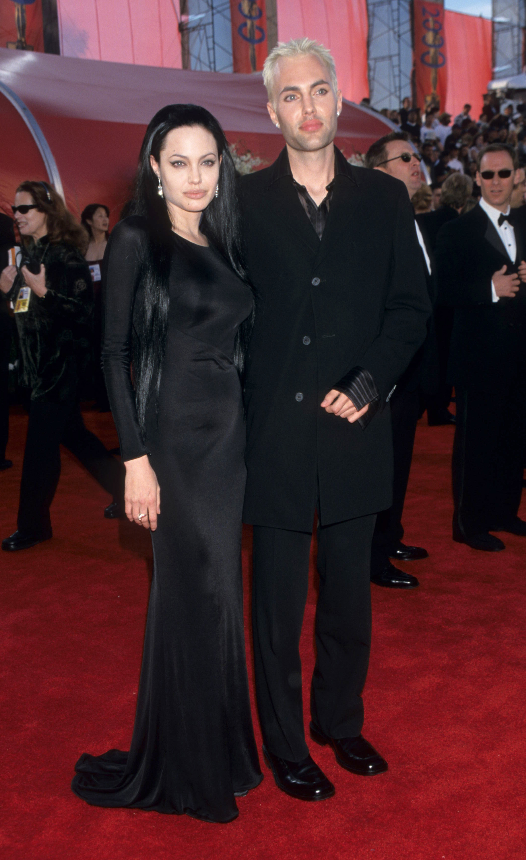 angelina jolie in a goth dress and dark hair on the red carpet