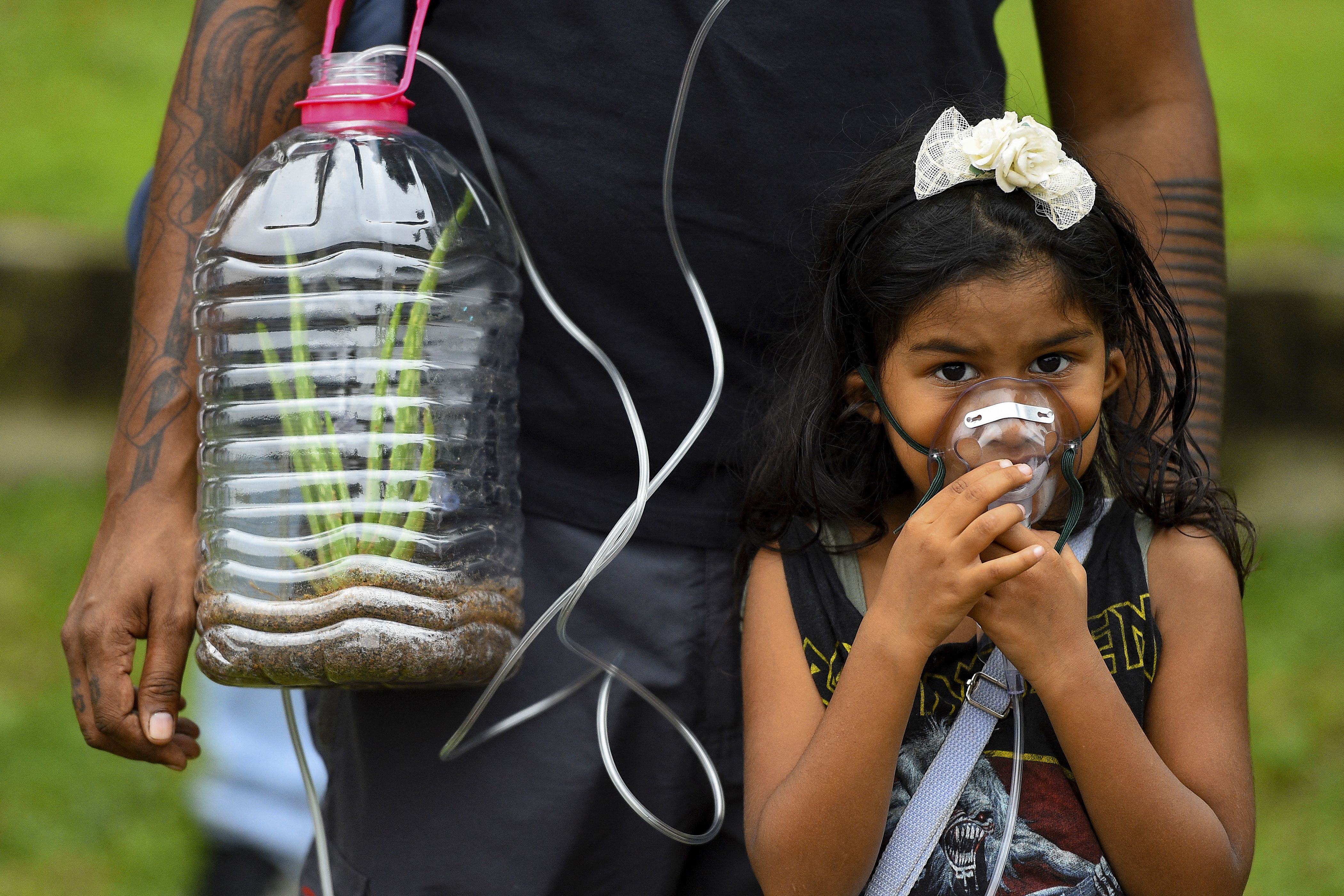 A young protester takes part in a climate demonstration in Colombo, Sri Lanka, in March this year. Photo: ISHARA S. KODIKARA/AFP via Getty Images
