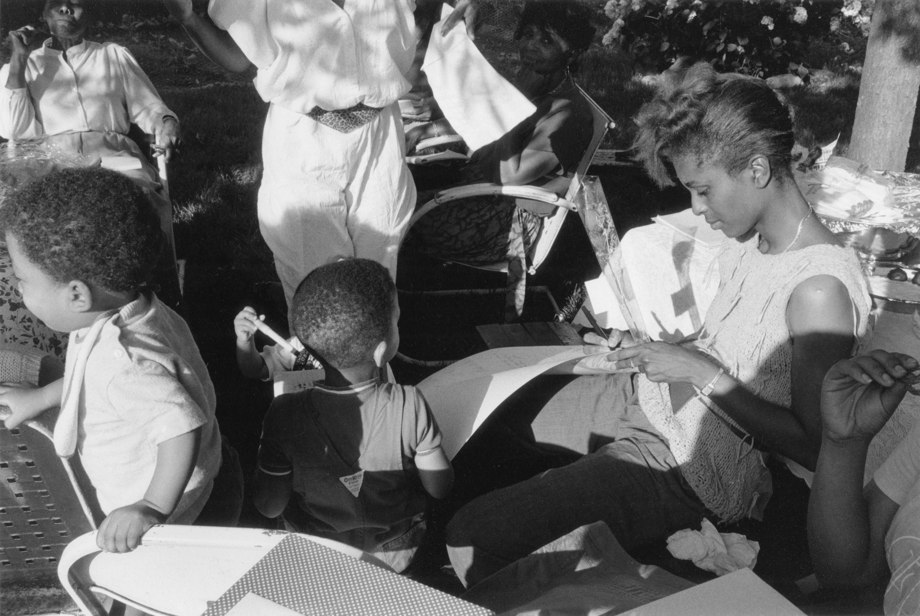 women and small children and buggies at a baby shower