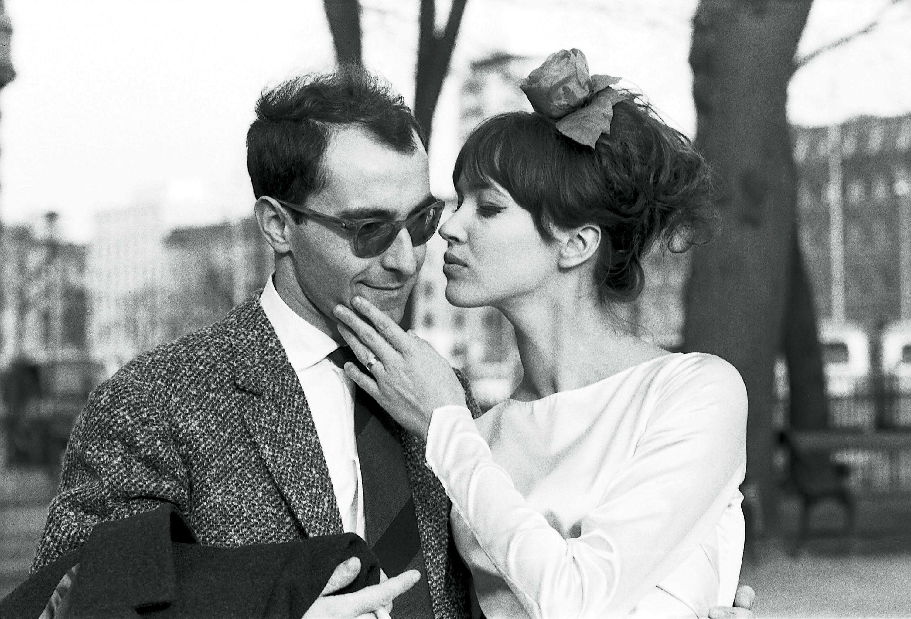 anna karina embracing jean-luc godard in the streets of paris at their wedding