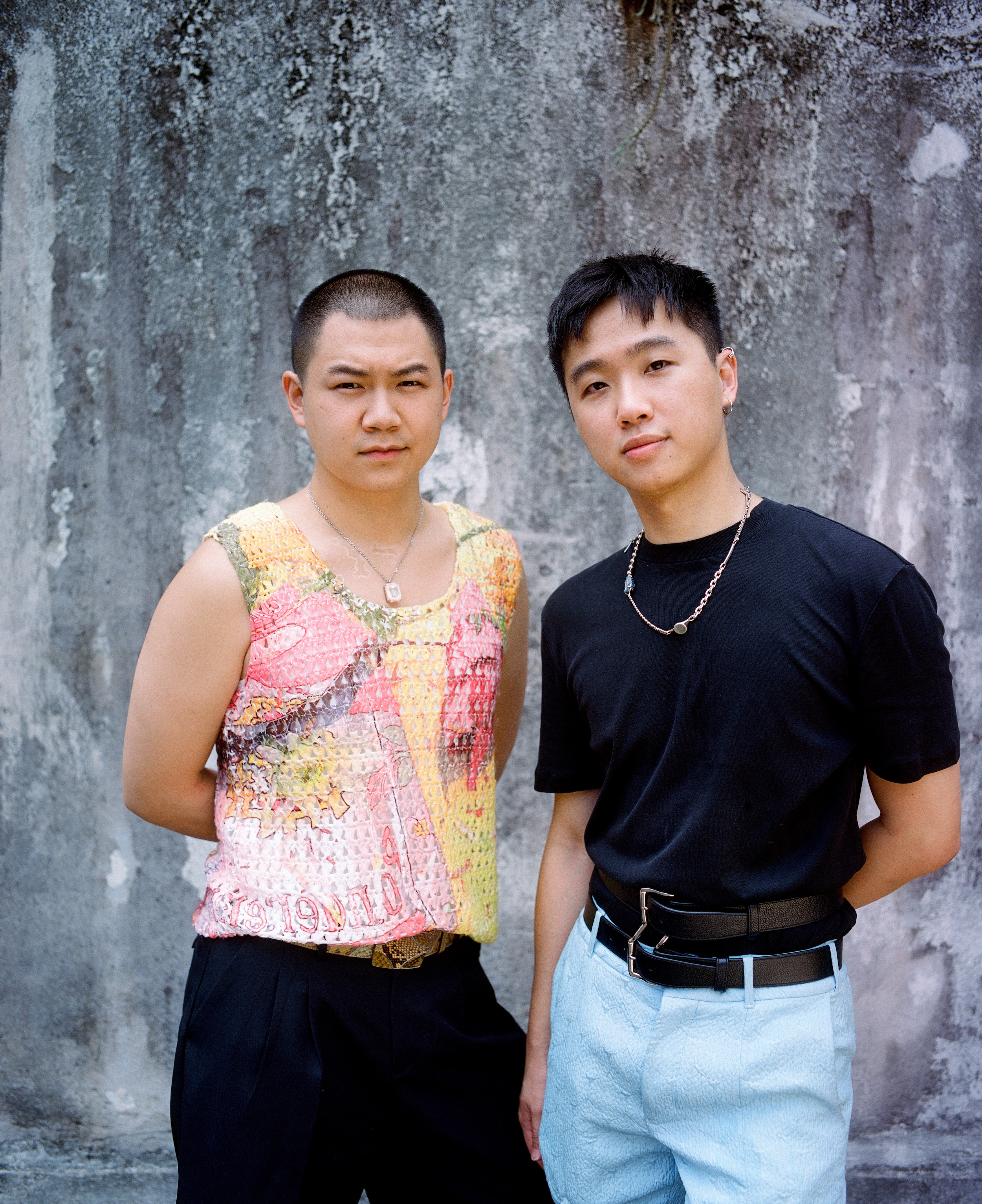 a close up portrait of derek cheng and alex po standing side by side