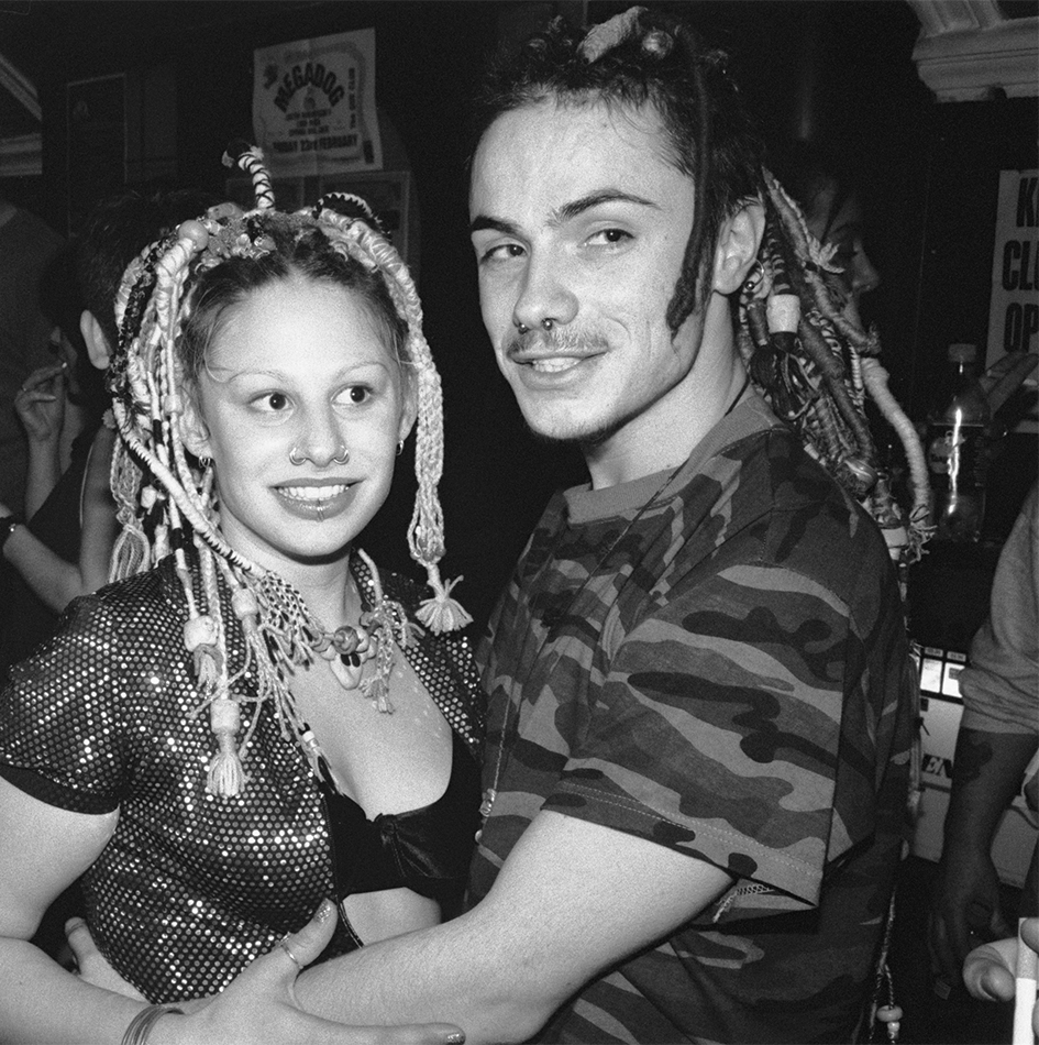a man and a woman with braided hair