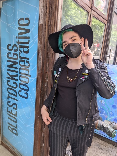 image of joan dark outside of bluestockings cooperative