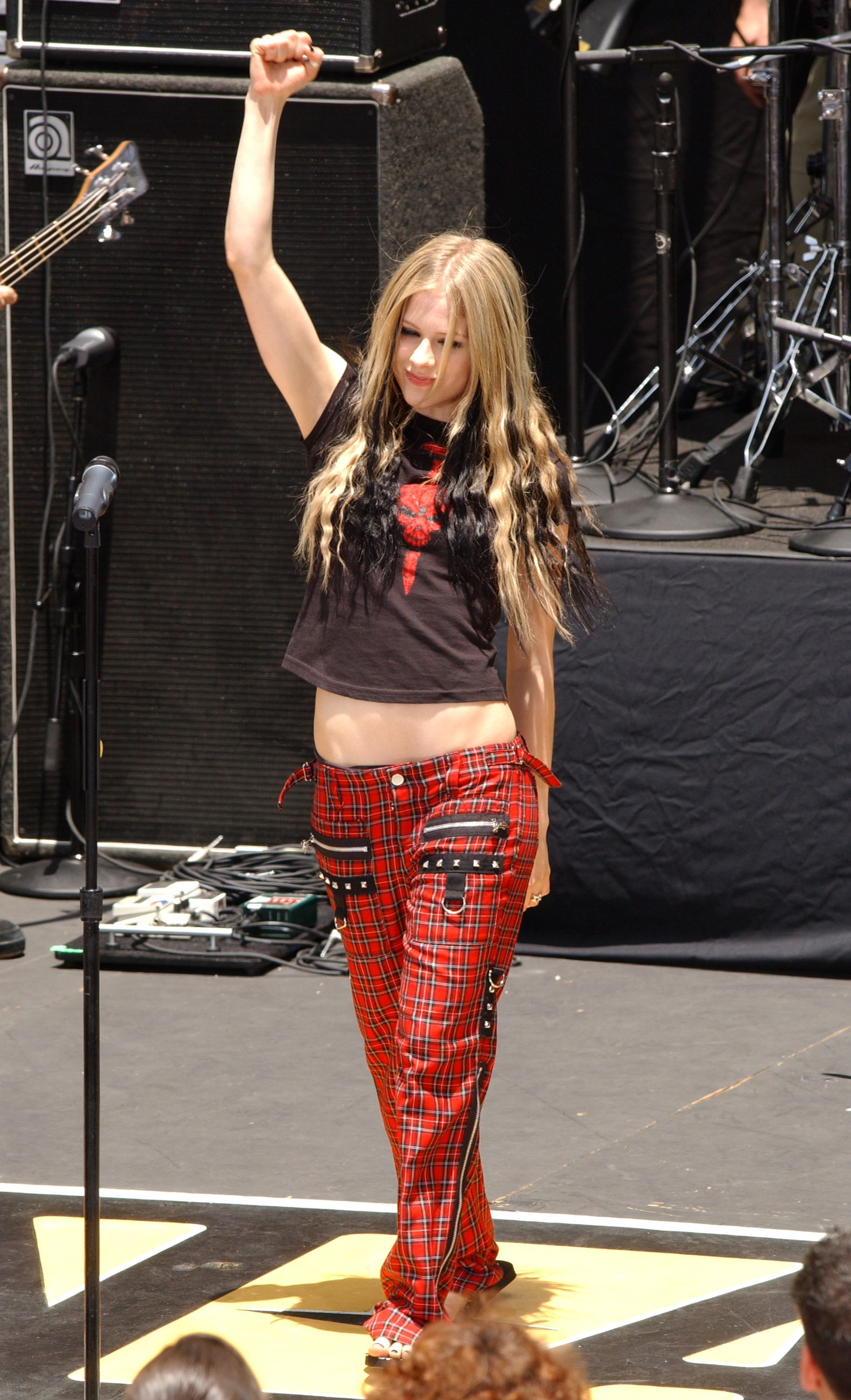 Avril Lavigne wearing tartan on stage in 2004 