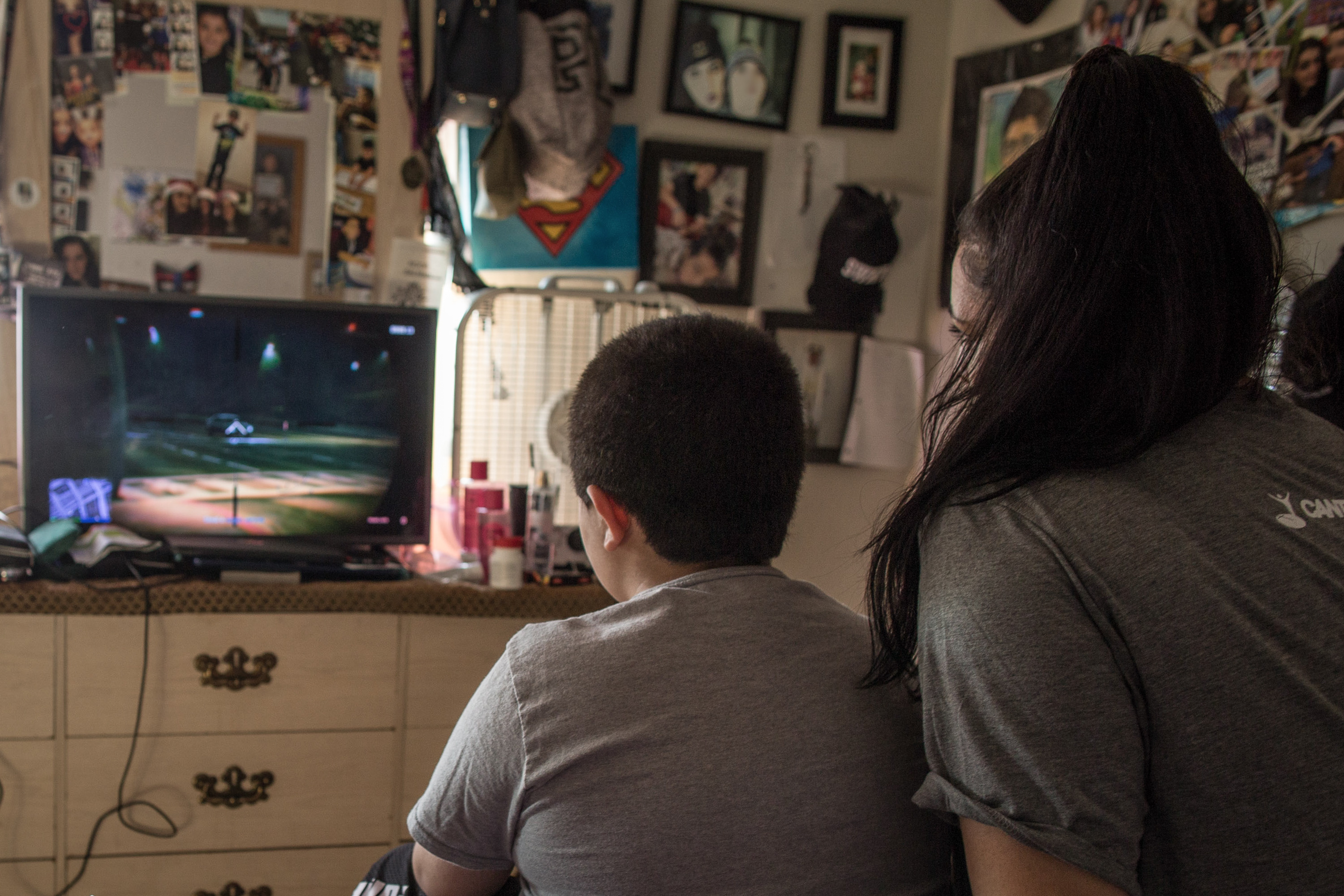 Noor Salman watches her son play video games. 