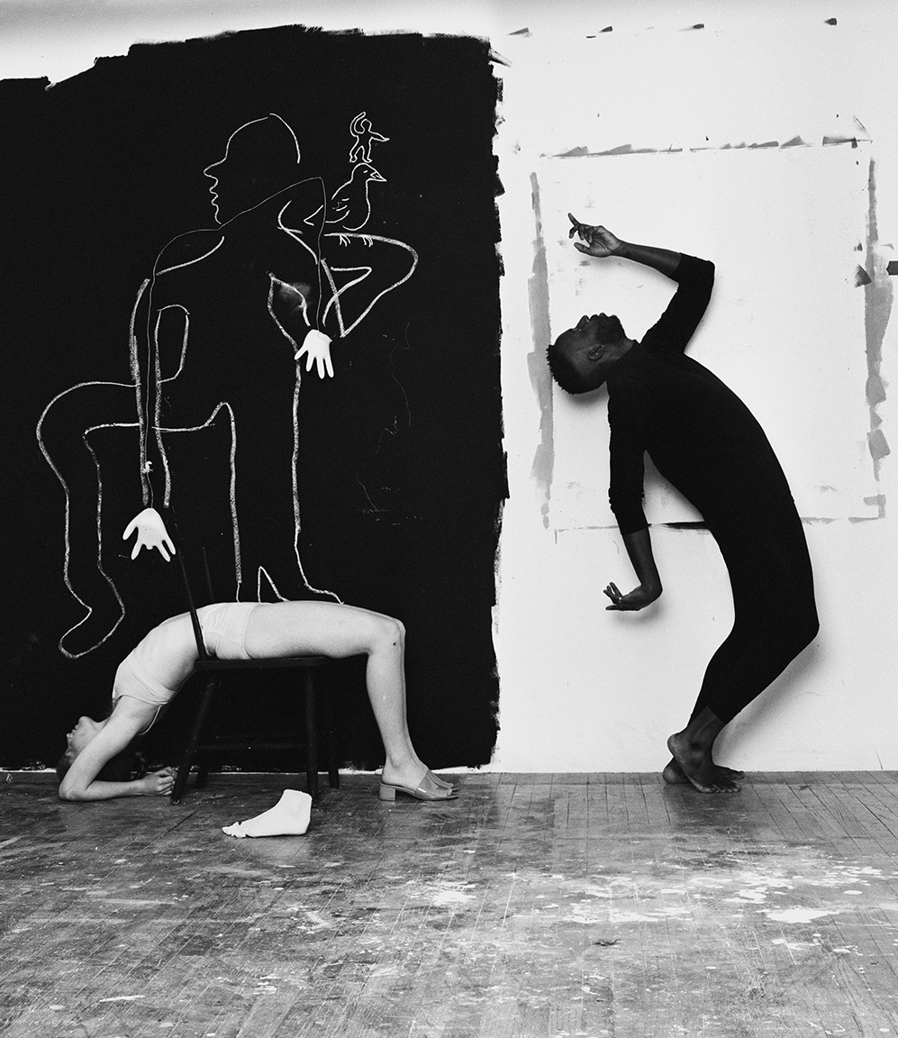 a portait of two people dancing in front of a painting by michael bailey-gates