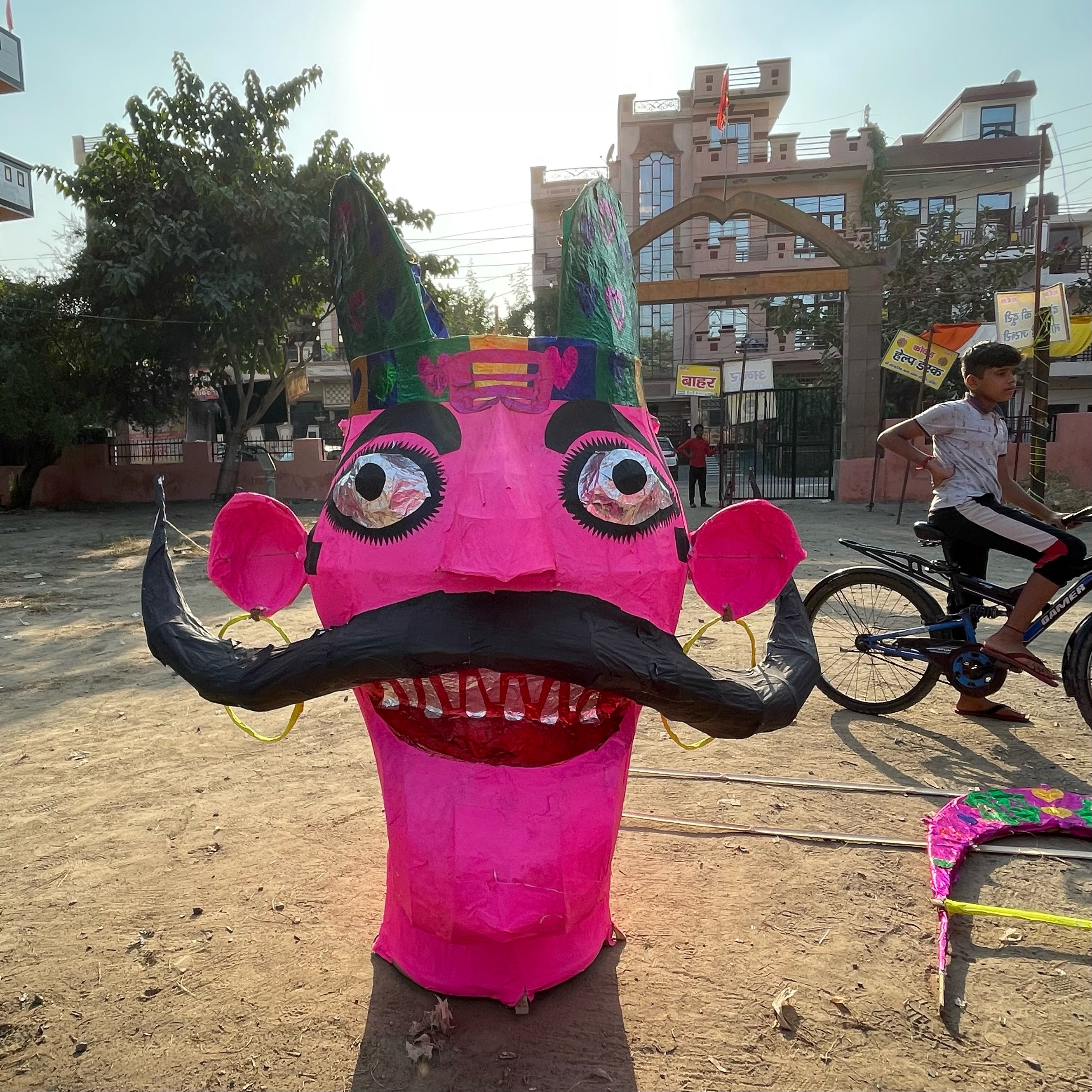 Pink papier mache head of Indian mythology figure