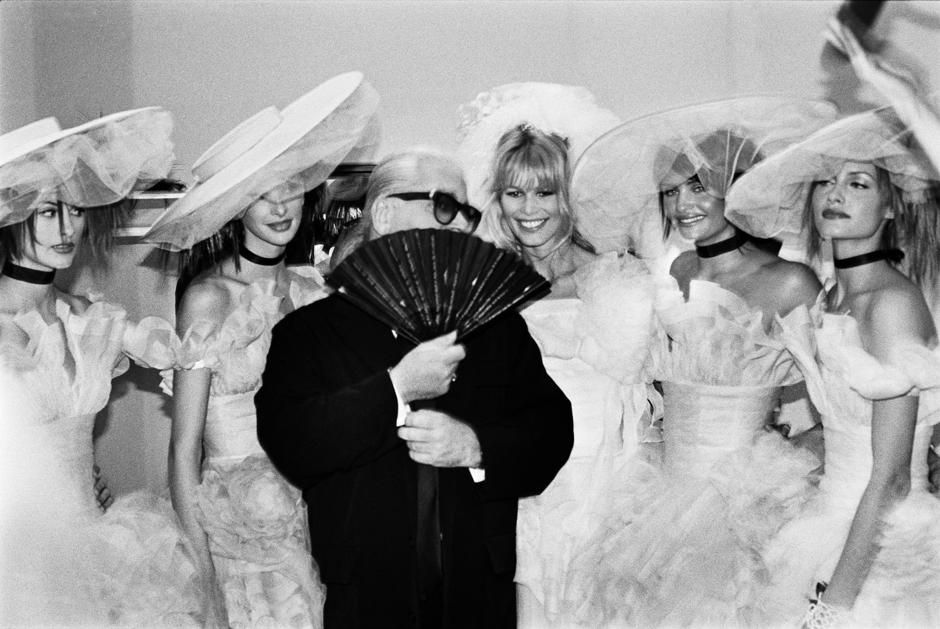 claudia schiffer and helena christensen with karl lagerfeld in paris by mario testino 1994