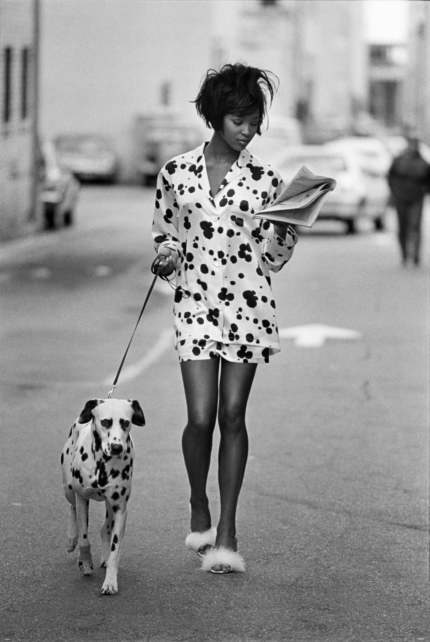 naomi campbell in pajamas walking a dog by peter lindbergh 1990
