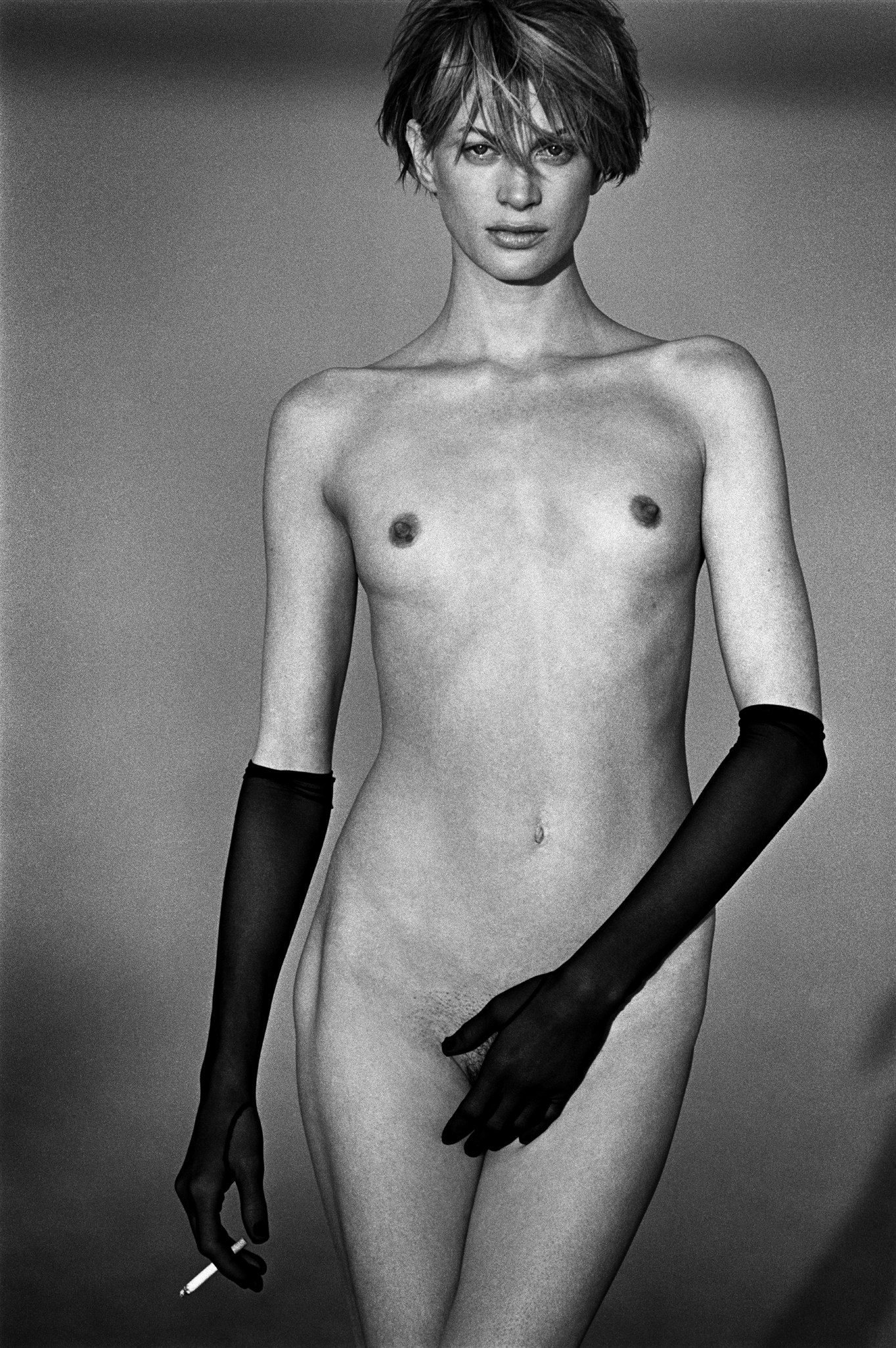 kristen mcmenamy naked wearing gloves and smoking a cigarette by peter lindbergh