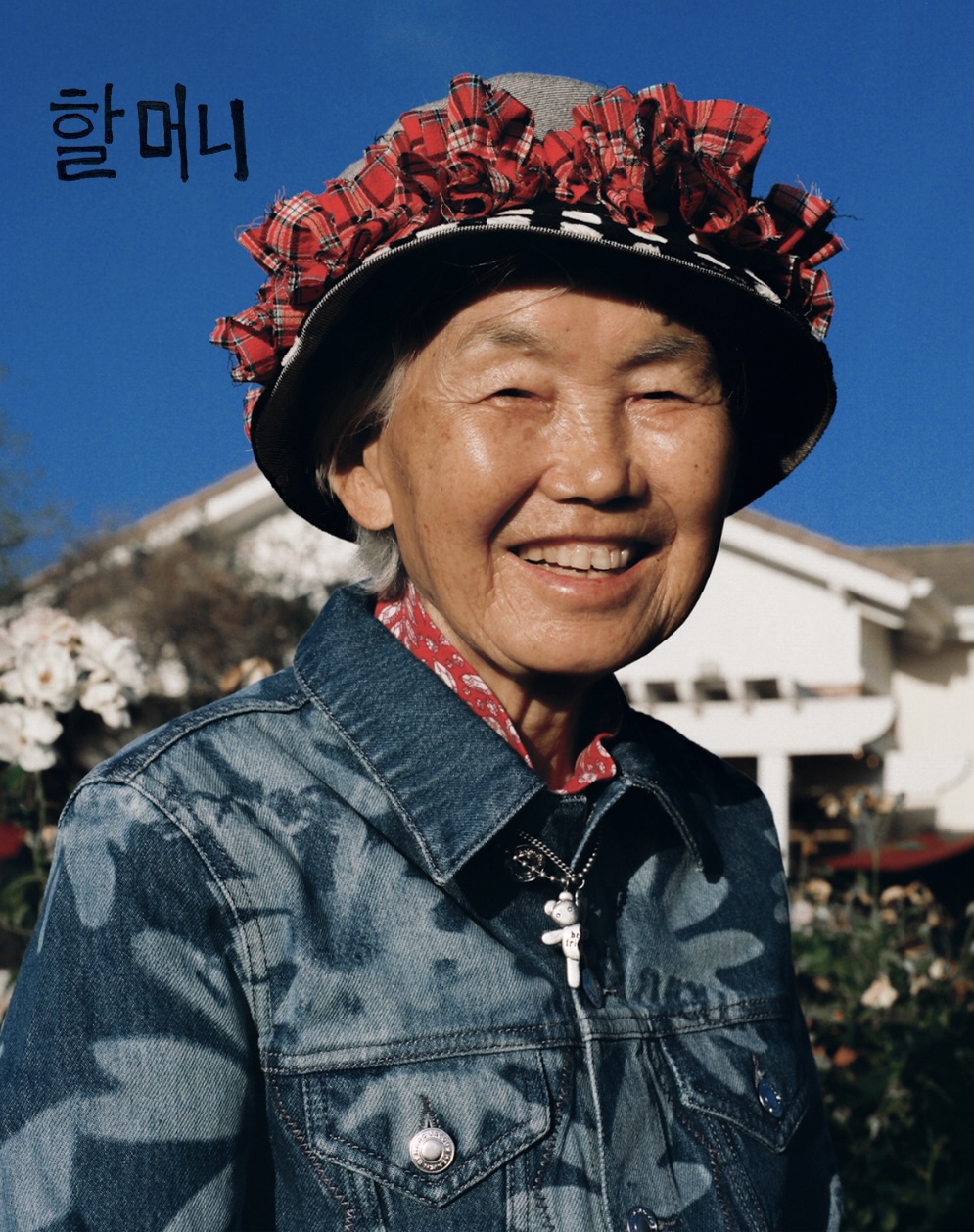 a smiling asian grandmother wearing heaven by marc jacobs 
