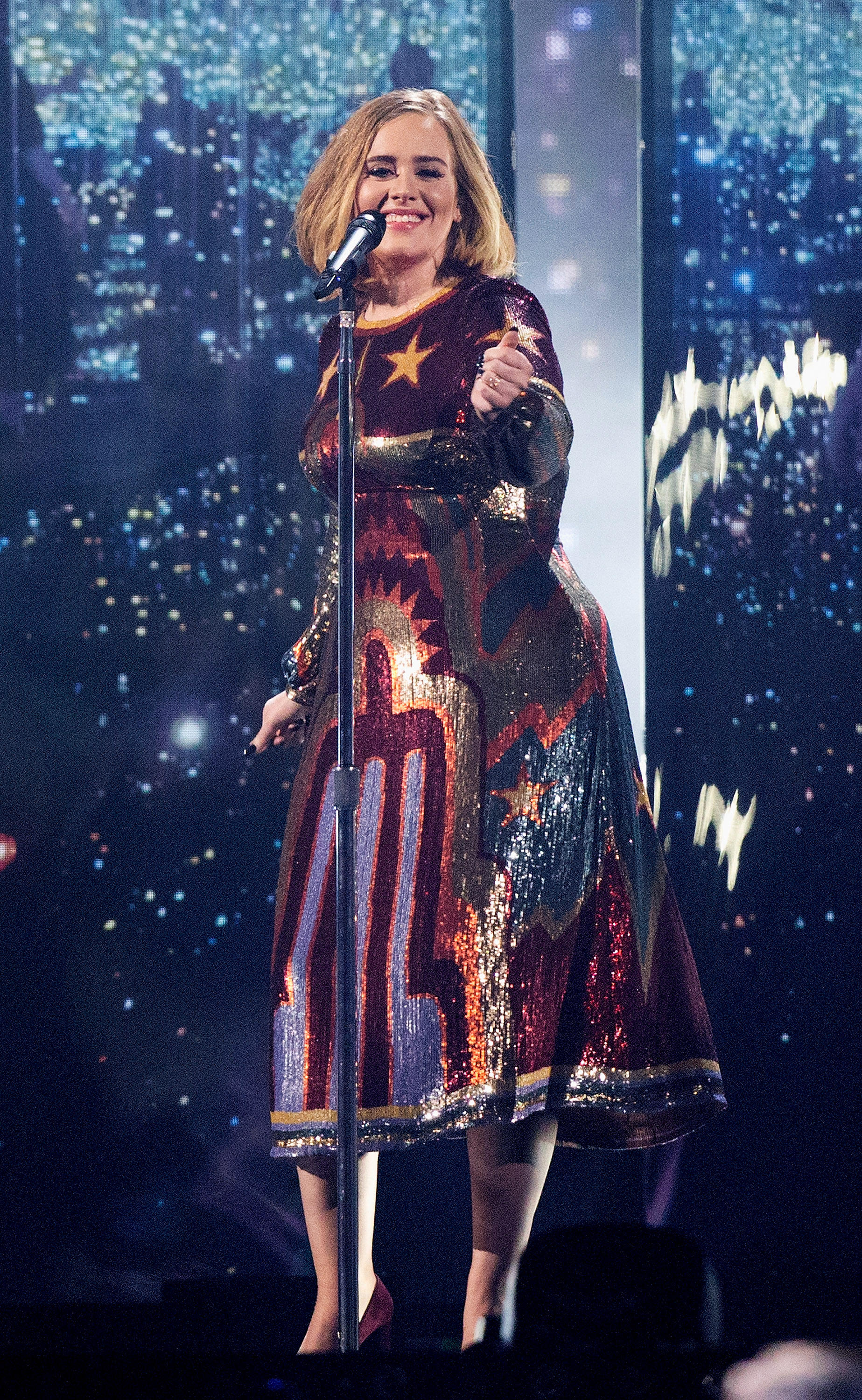 Adele in a sequined dress performing at the Brit Awards in 2016