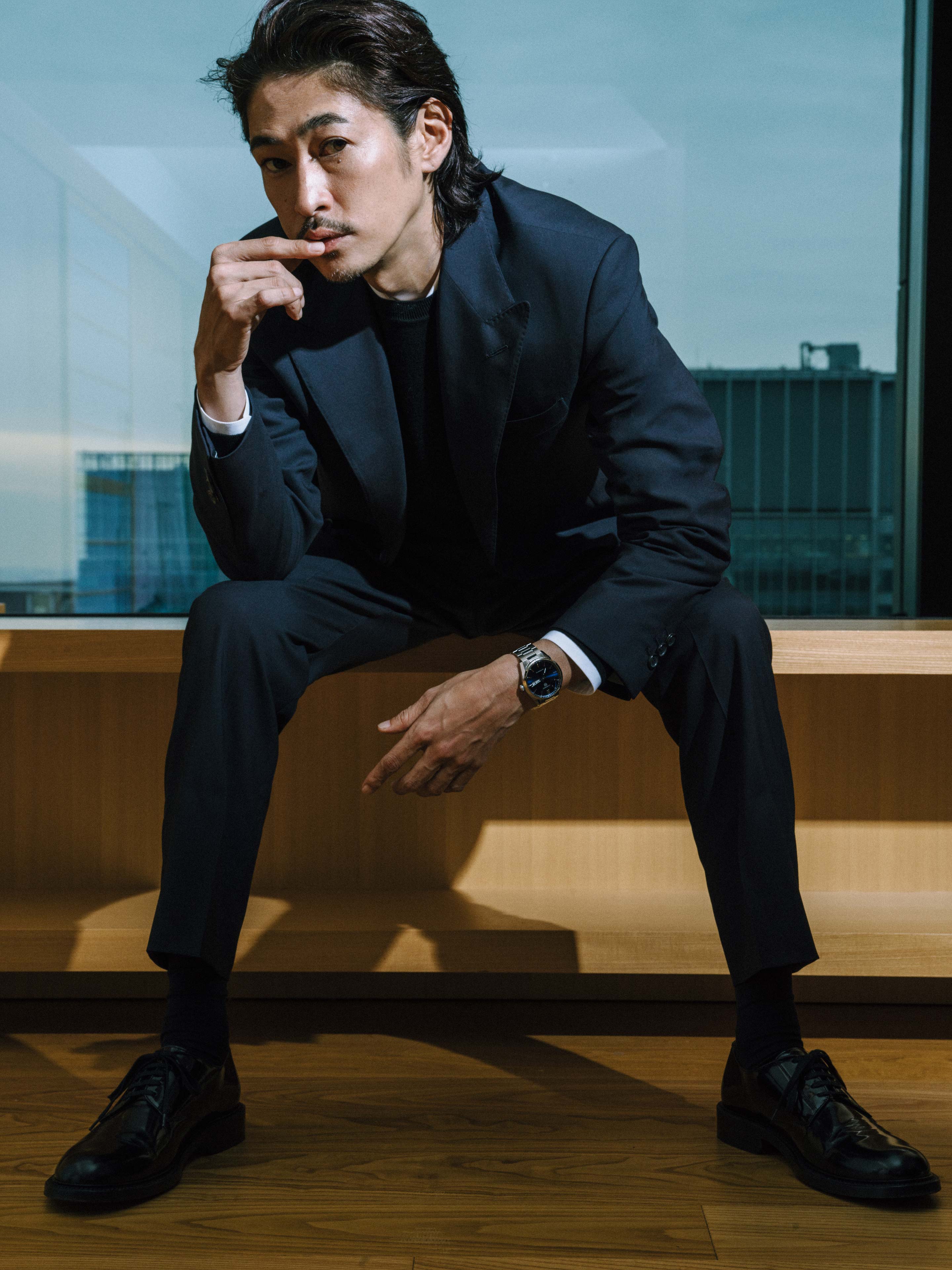 Yosuke Kubozuka wears Tag Heuer Carrera Calibre 5 Day-Date with blue dial