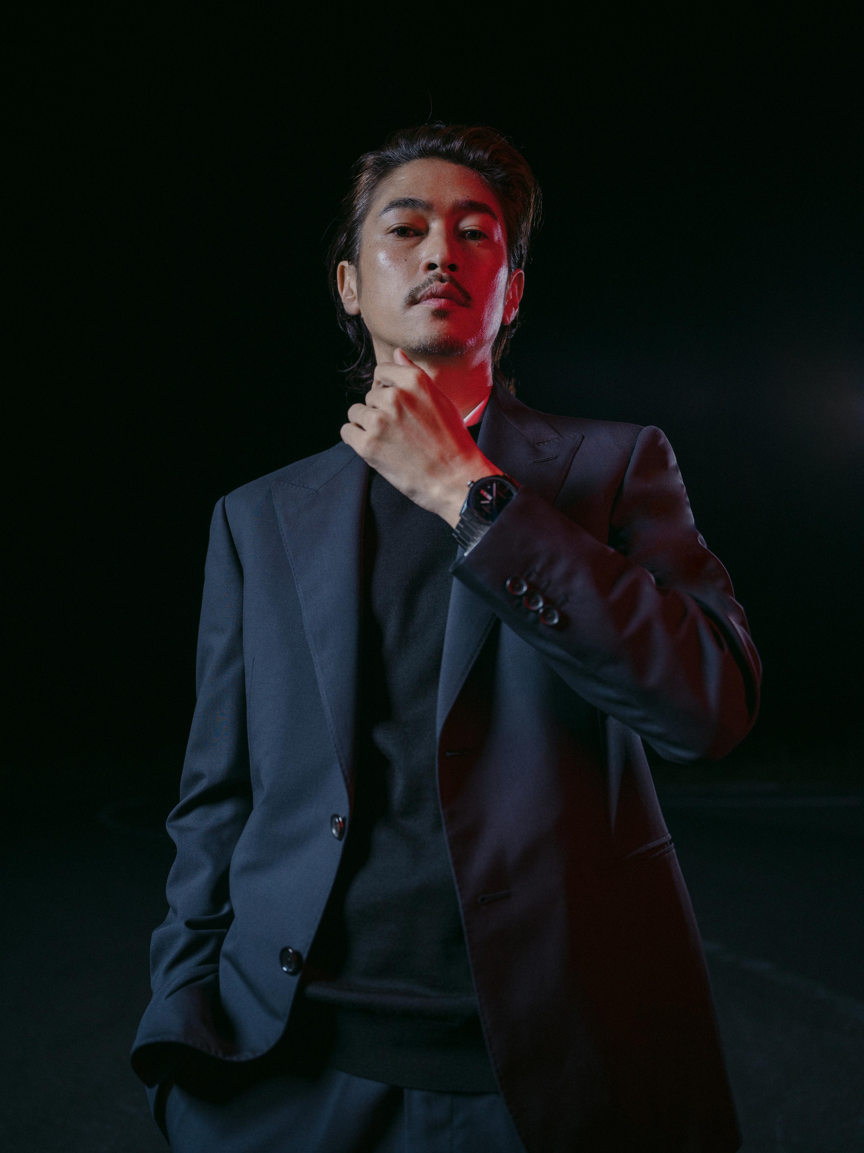 Yosuke Kubozuka wears Tag Heuer Carrera Calibre 5 Day-Date with blue dial