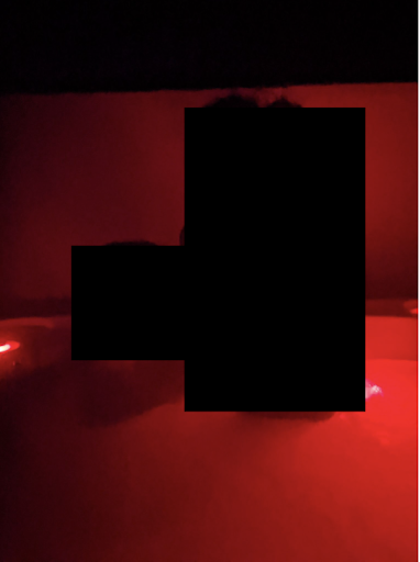 Censored woman in hot tub 