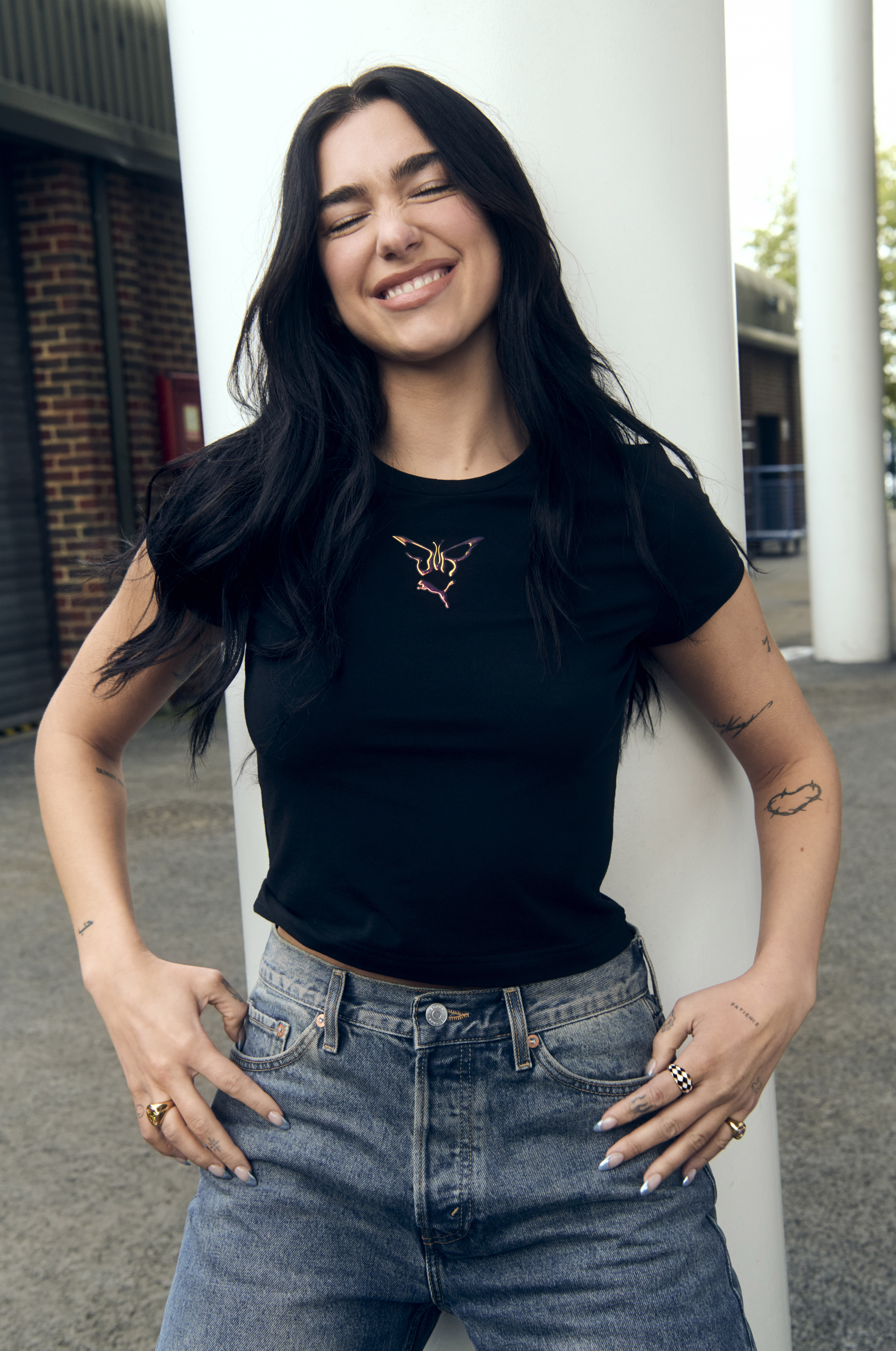 Dua Lipa poses wearing her new Flutur x PUMA collection