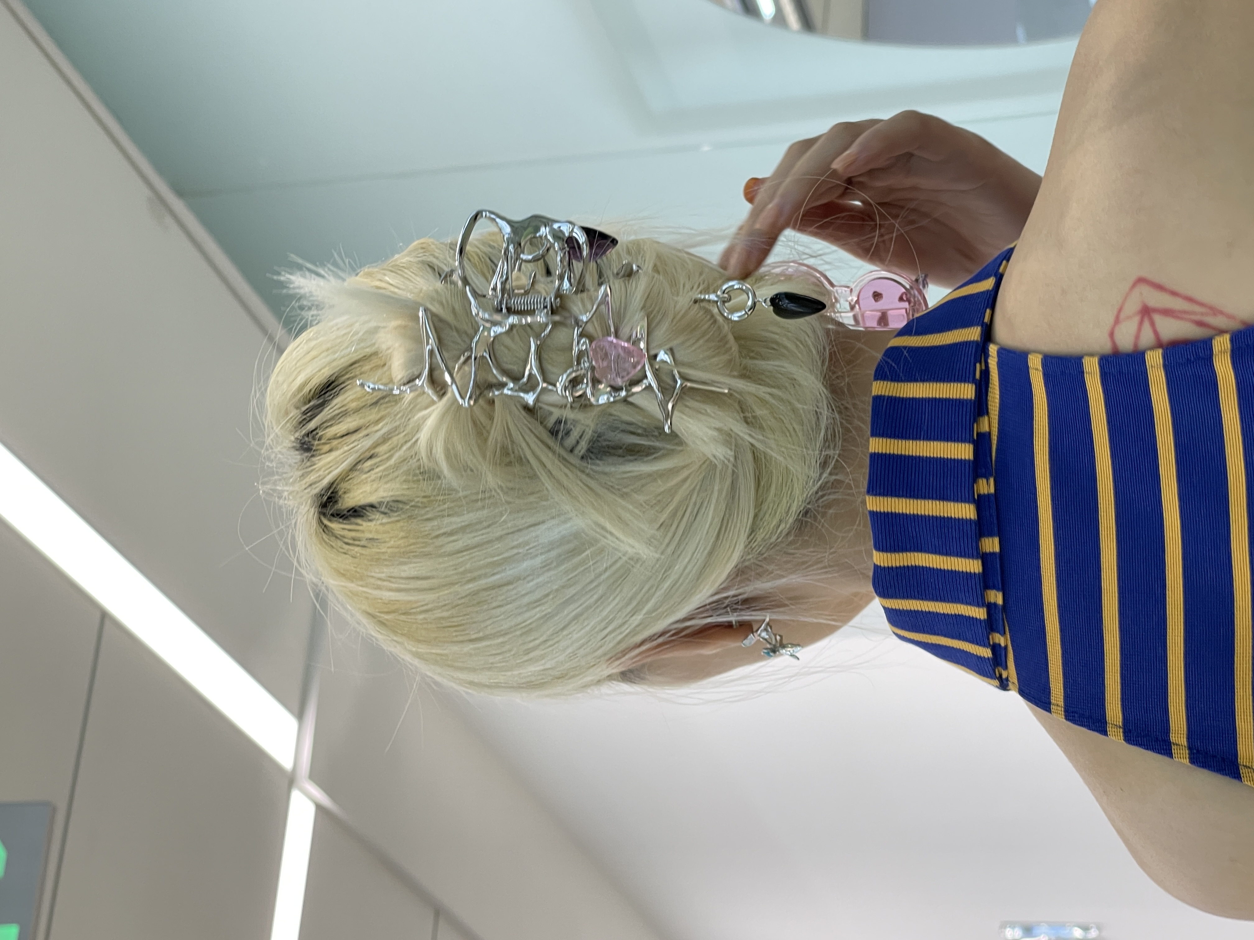 a silver and crystal jewelled hair piece by yvmin