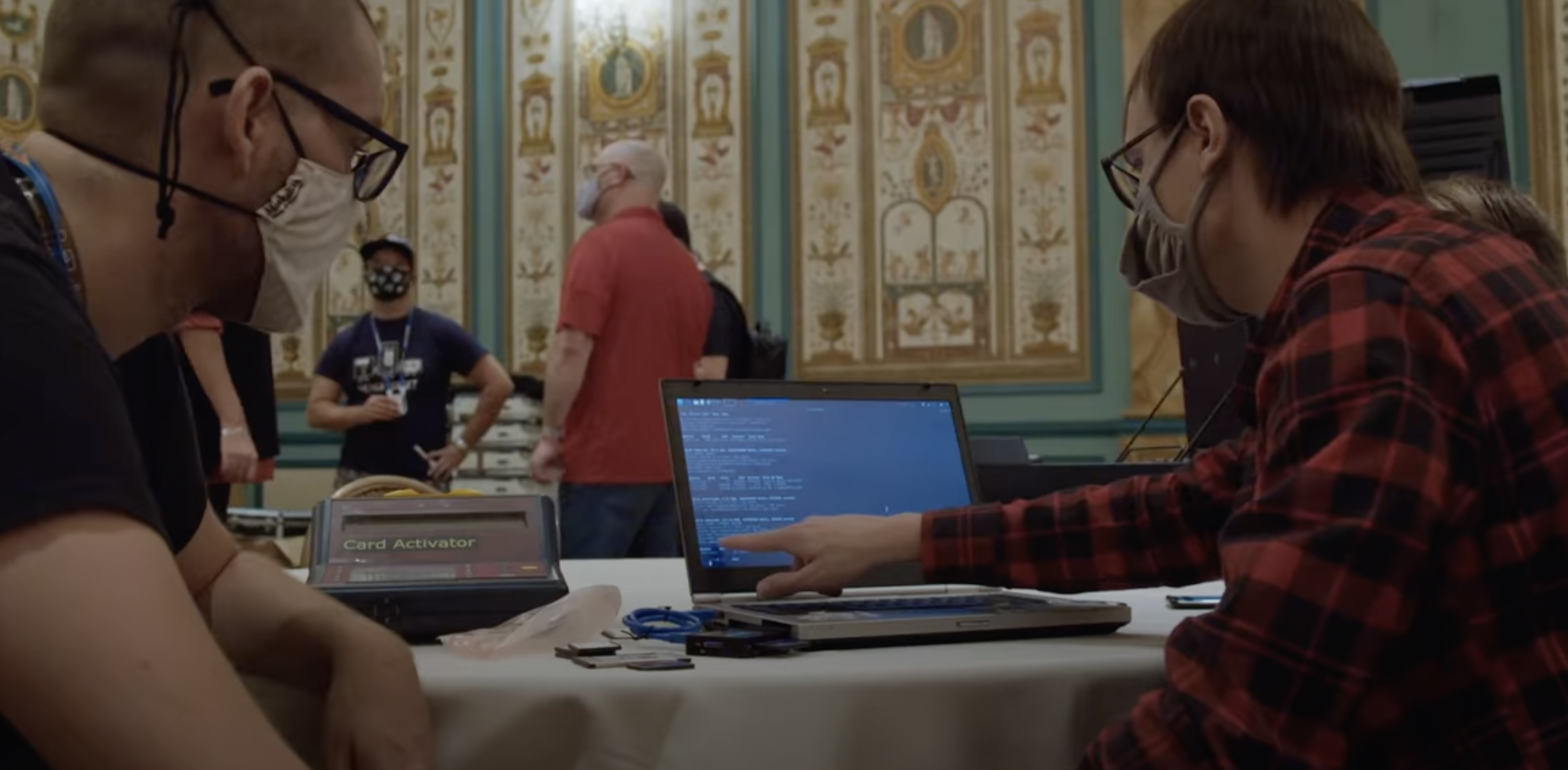 Two hackers at DEFCON try to access the administrator files of a voting machine. (VICE News)