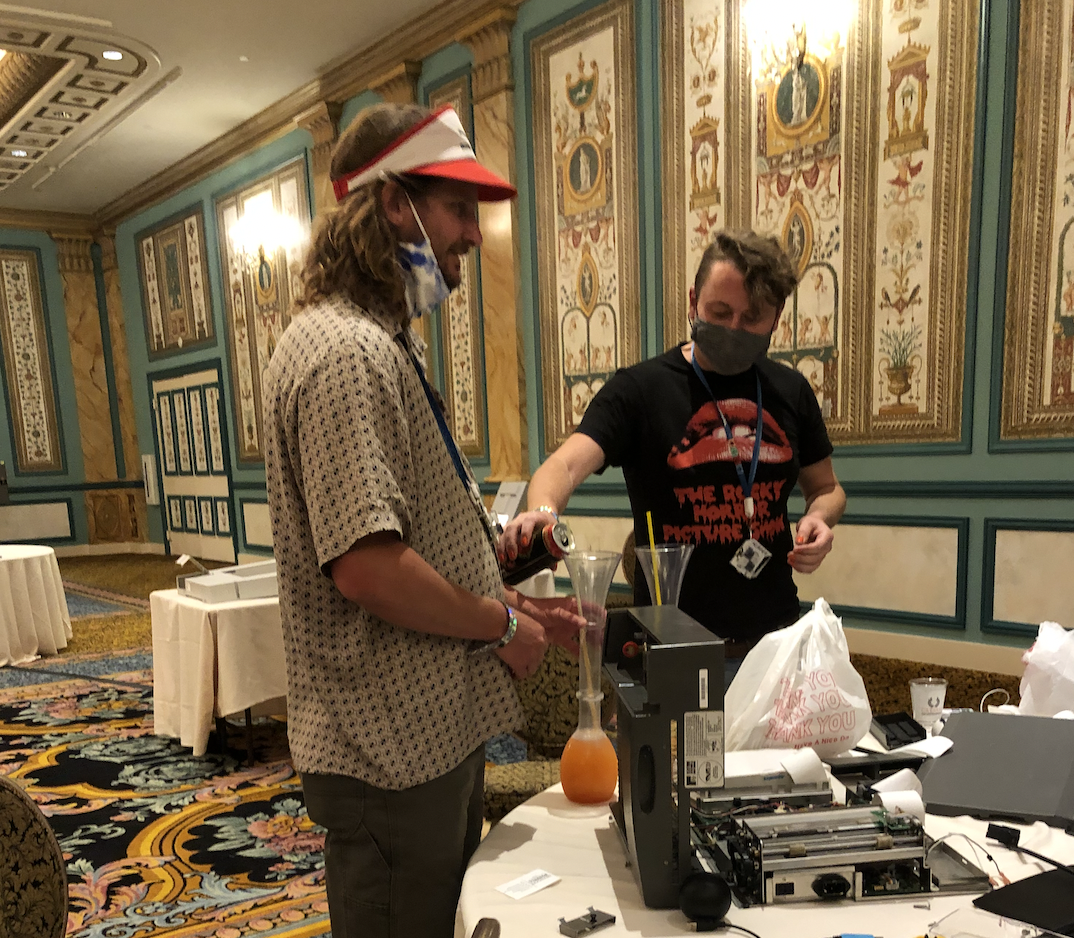 At the end of DEFCON, a table is covered in machinery, food wrappers, and a 2-foot-tall margarita cup. (Spenser Mestel for VICE News) 