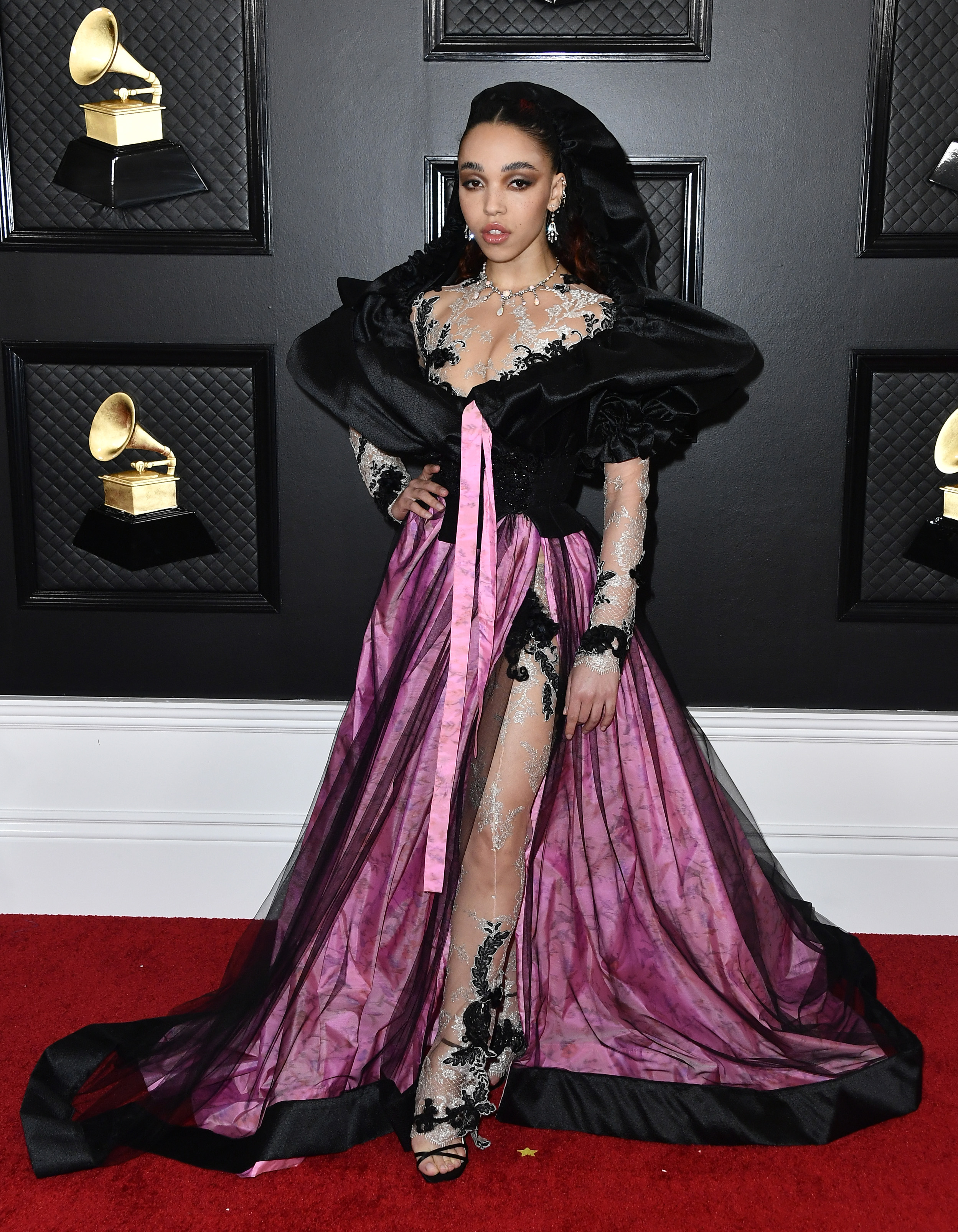 fka twigs posing on the red carpet in a fuschia baroque corseted gown at the grammys 2020