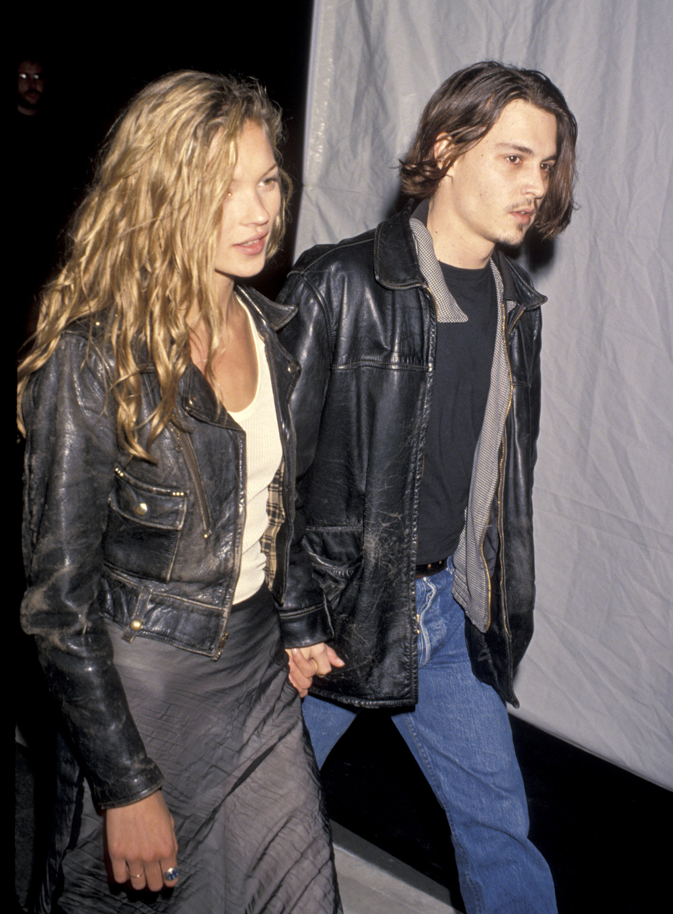 kate moss and johnny depp holding hands and wearing leather jackets in 1994