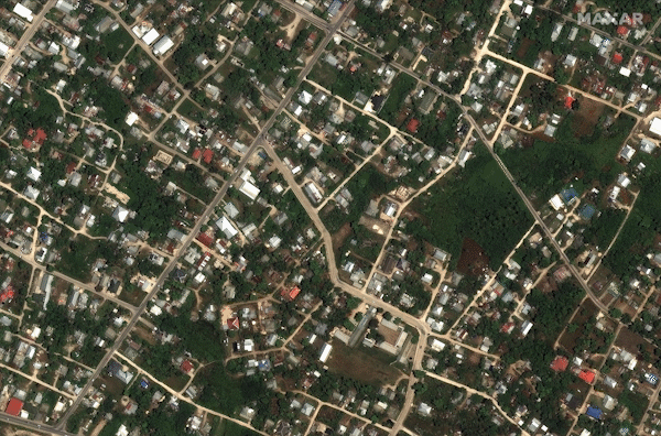 This combination of satellite images released by Maxar Technologies on January 18, 2022 shows residential homes and buildings in an area of Tonga on December 19, 2021 (top picture) and the same area on January 18, 2022, covered in ash following the eruption of the Hunga-Tonga - Hunga-Haa'pai volcano on January 15, 2022. Handout / Satellite image ©2022 Maxar Technologies / AFP