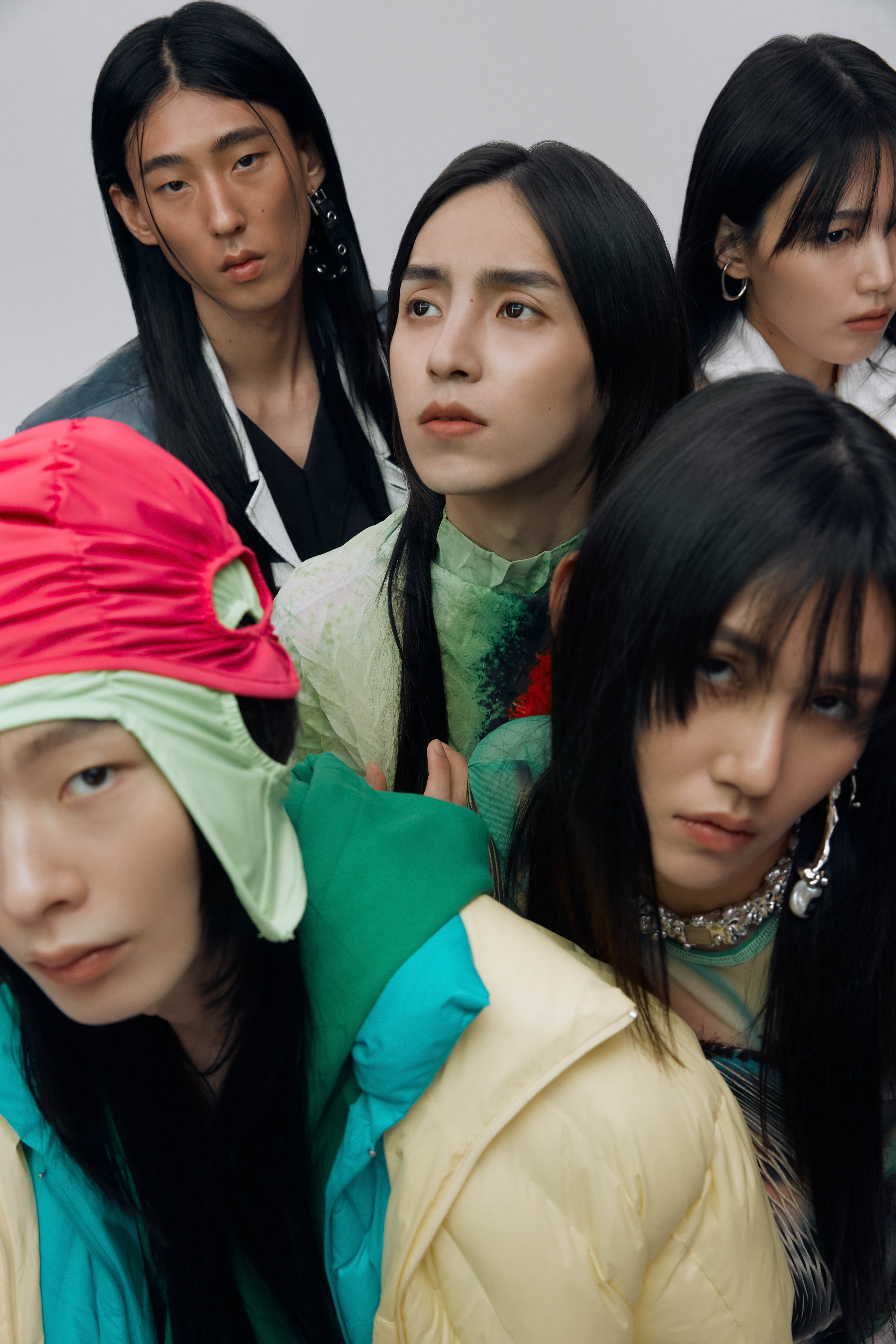 a group of models wear colourful layered looks by the korean designer sung ju